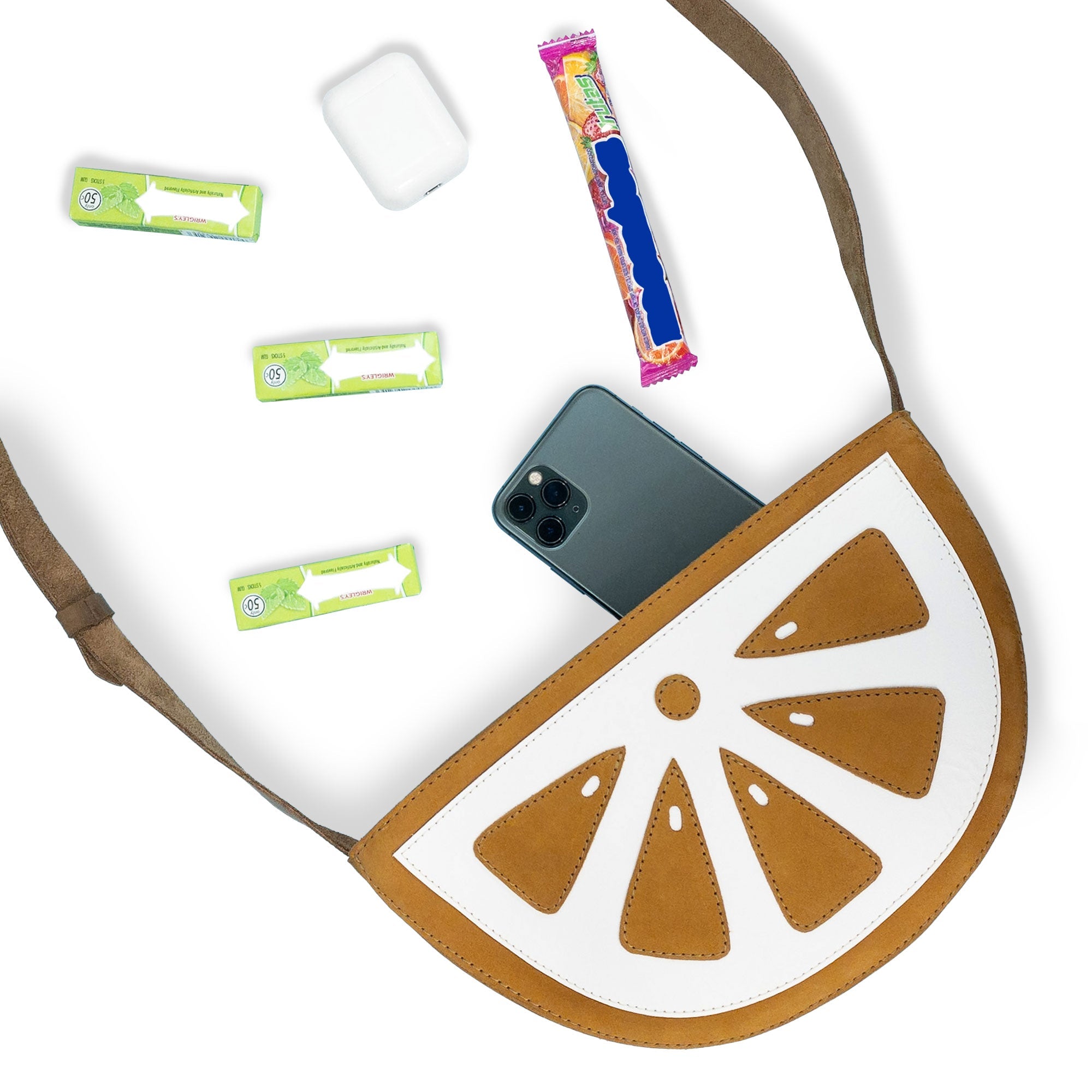 Inside view of the Lemon-Shaped Shoulder Bag by Tudi Frudi, displaying its spacious interior. This Lemon-Shaped Shoulder Bag with Adjustable Strap is functional as a Messenger Bag and Vintage Purse. Made from Full Grain Leather with exquisite craftsmanship through Small Batch Production, hand cut and hand sewn by artisans in La Antigua Guatemala & Oaxaca Mexico.