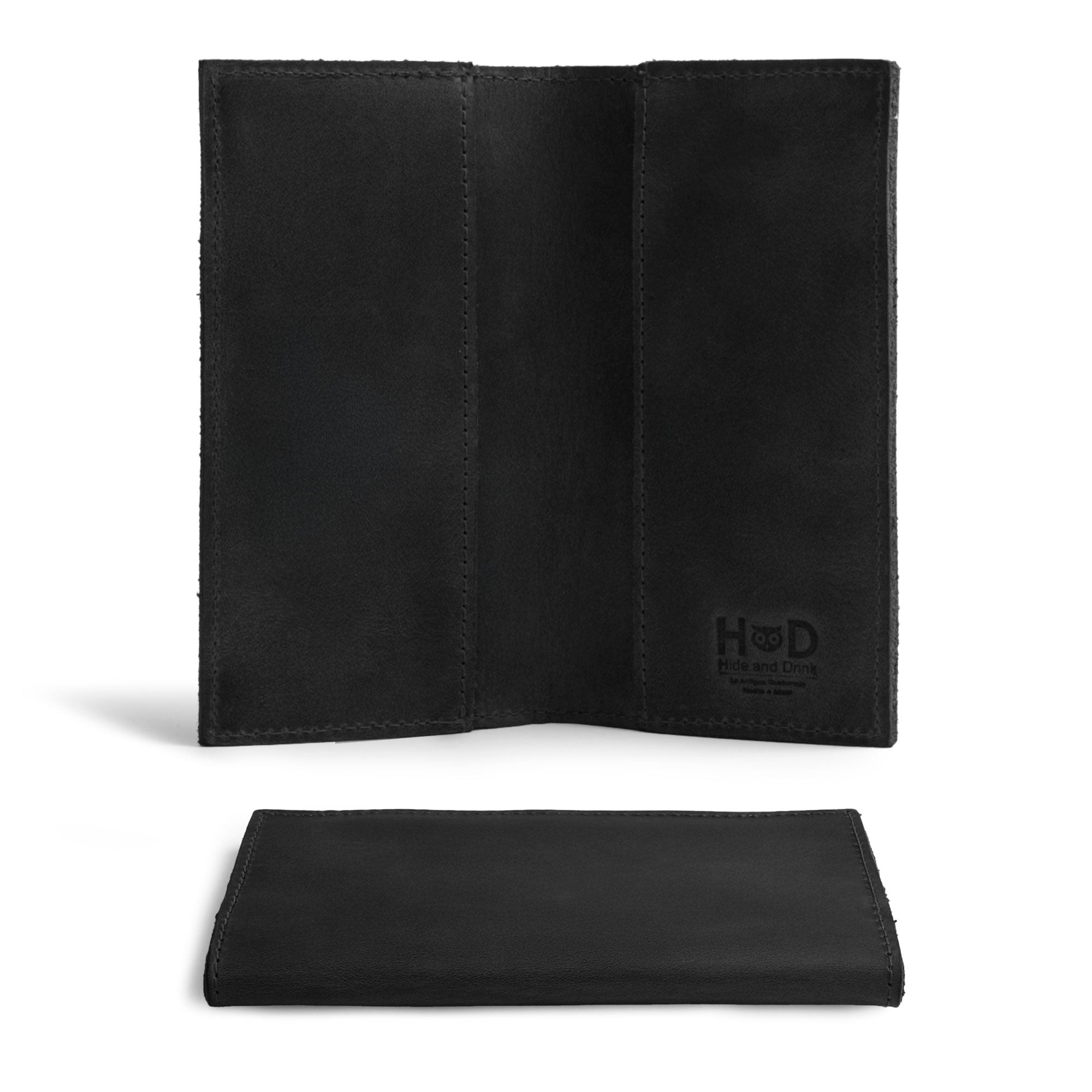 Open view of the Checkbook Leather Cover by Hide & Drink in black, functioning as a minimalist organizer for standard checkbooks. Made from full grain leather, this artisan piece is handmade in La Antigua Guatemala and Oaxaca Mexico, highlighting small batch production.