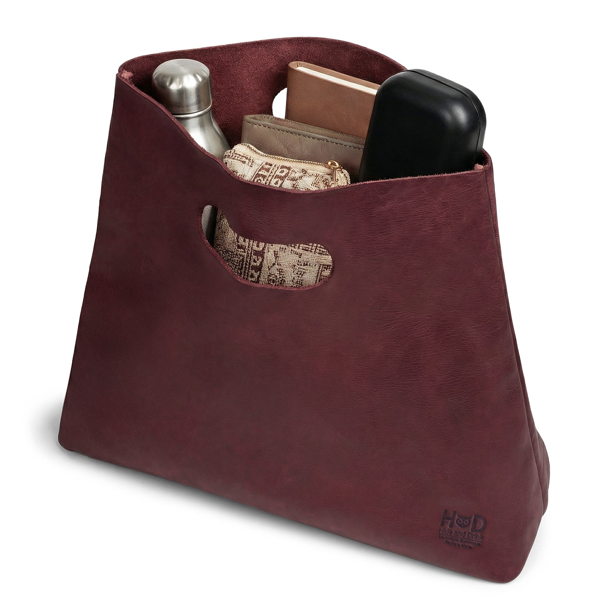 Close-up view of the interior of the red Minimalist Boho Handbag by Hide & Drink, highlighting functionality and style. This Minimalist Handbag for Women serves as a versatile Rustic Purse, crafted from high-quality Full Grain Leather, indicative of StockyardX's artisan ethos in Small Batch Production from La Antigua Guatemala & Oaxaca Mexico.