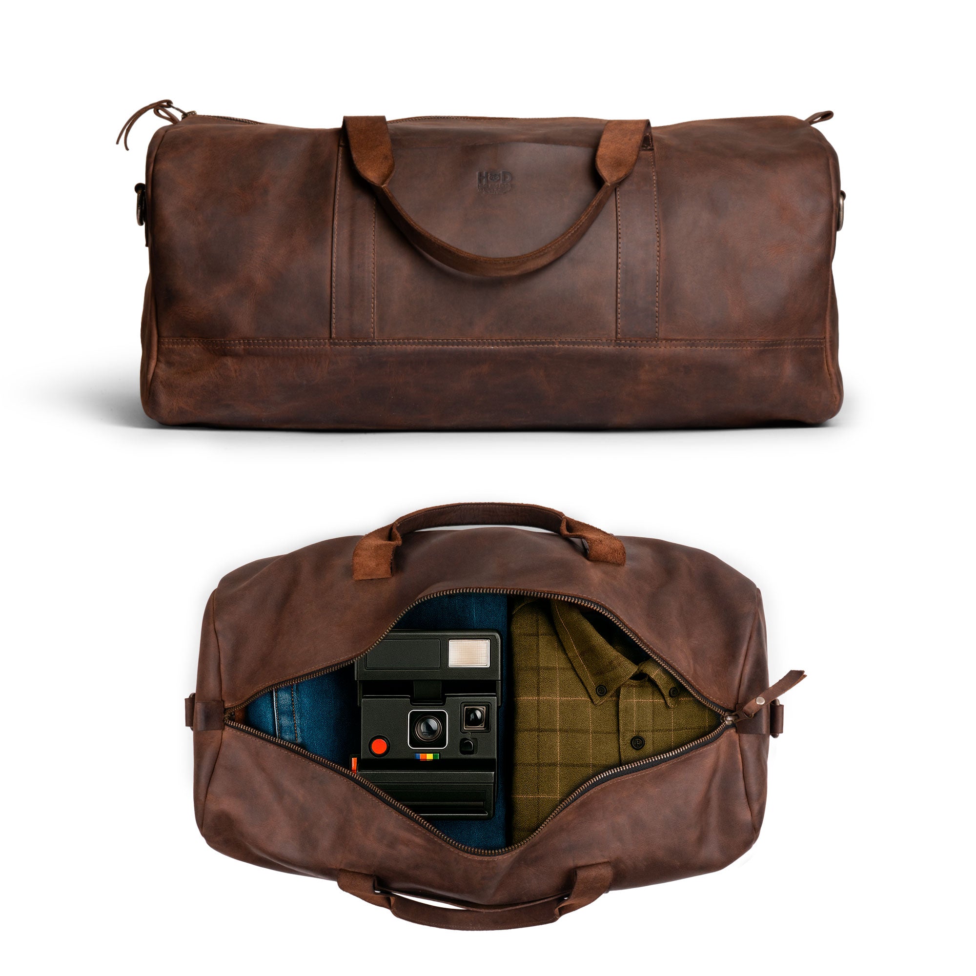 Inside view of the Hide & Drink Luggage Duffle Bag with Shoulder Strap, revealing a spacious interior ideal for travel as a Full Grain Leather travel overnight bag, handcrafted with care by artisans in La Antigua Guatemala & Oaxaca Mexico.