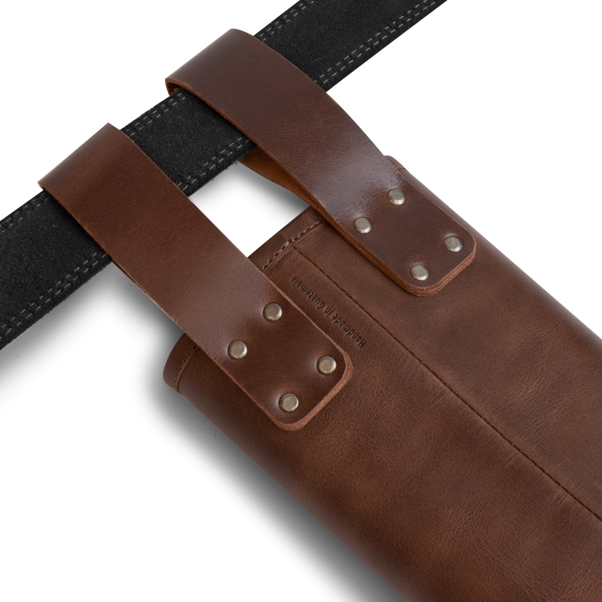 Detail view of The Orval, Bolts Hip Quiver by Valhalla Gear featuring sturdy leather straps. This full grain leather crossbow quiver is a high-quality storage carrier for arrows, emphasizing its status as a bolt quiver designed for hunting and archery. The unique handmade craftsmanship highlights its artisan roots, perfect for outdoor enthusiasts.