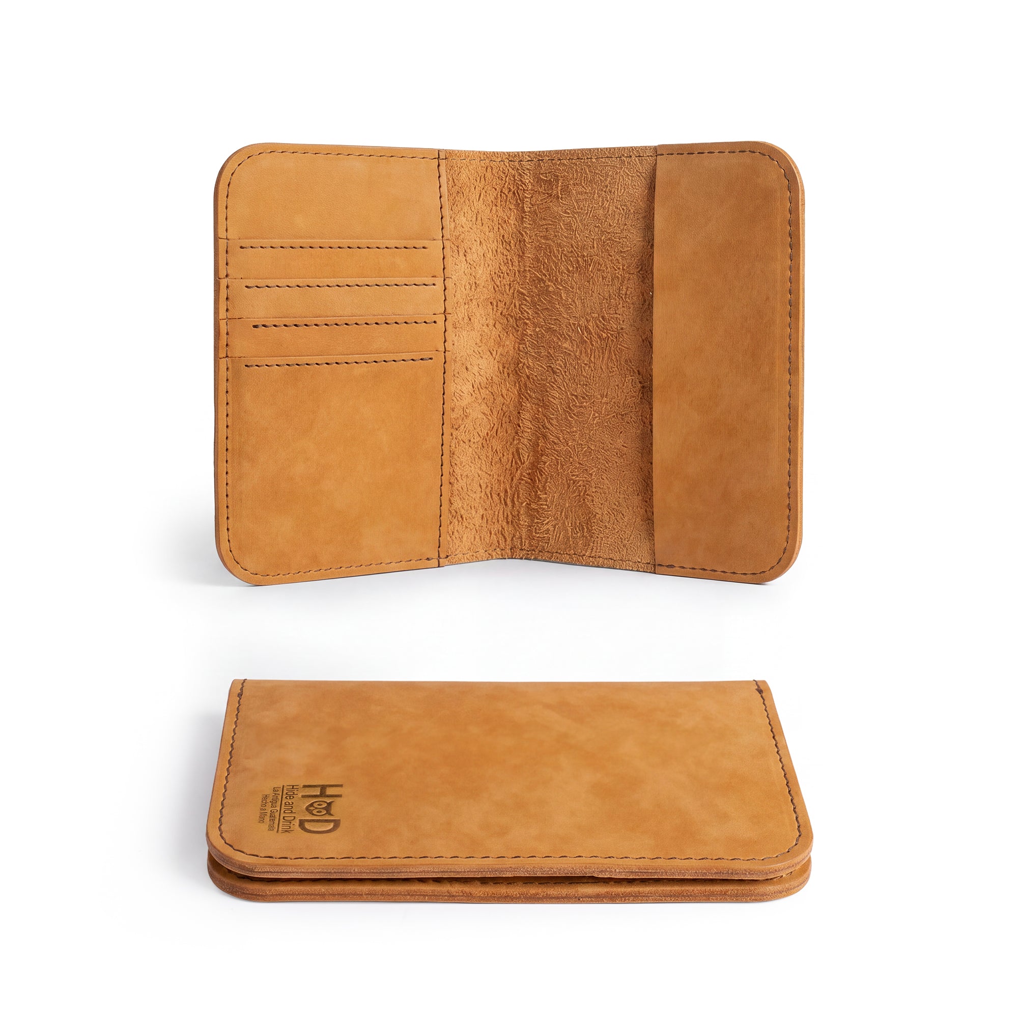Interior compartments of the Hide & Drink Travel Wallet showcasing efficient design. This travel wallet is a stylish bifold passport case, artisan-made with full grain leather in La Antigua Guatemala.