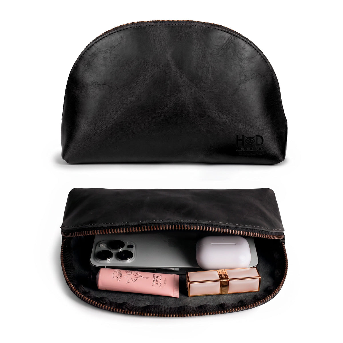 Open view of the Accessory Pouch Organizer Hand Bag from Hide & Drink, filled with cosmetic essentials. This classy Cosmetic Travel Organizer with Hand Strap for Women is an ideal Makeup Bag or Classic Handbag, handcrafted to perfection in La Antigua Guatemala & Oaxaca Mexico.