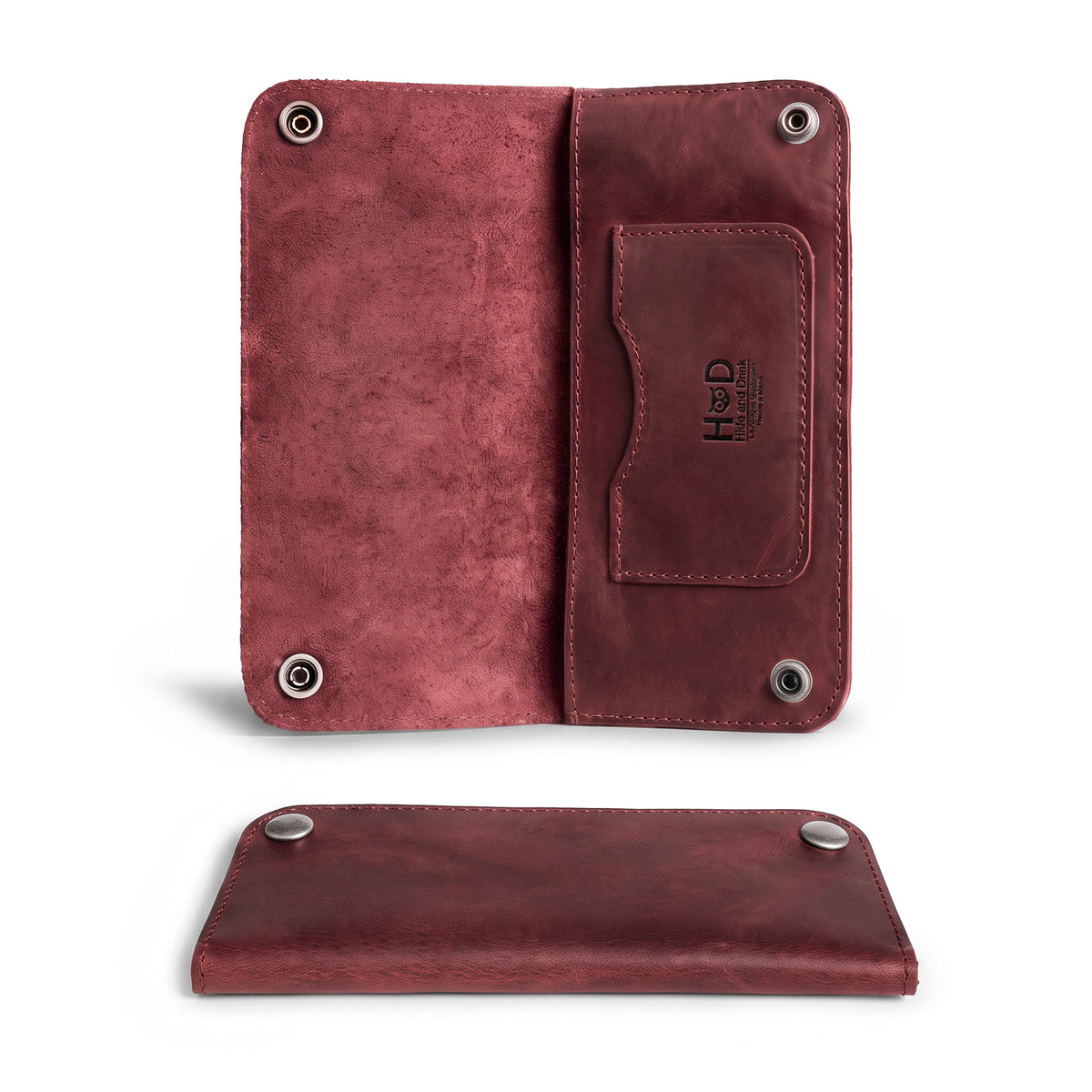 Inside view of the Red Double Snap Folio Wallet by Hide & Drink, featuring compartments for cash and cards. This full grain leather piece serves as a practical rectangular flat bill holder with card slot, perfect as a night bag or travel accessory. Handcrafted with care in La Antigua Guatemala & Oaxaca Mexico.