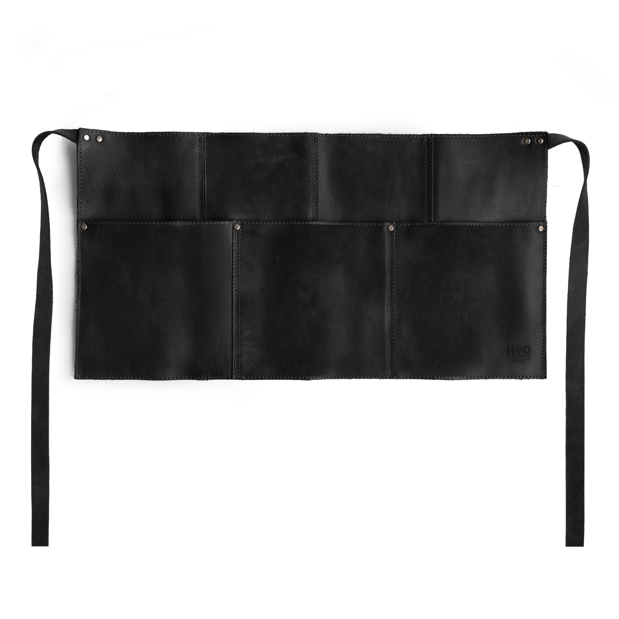 Showcasing the black Hide & Drink Barista Leather Waist Apron, highlighting its riveted pockets, perfect for serving needs. This full grain leather apron is artisan handcrafted in La Antigua Guatemala & Oaxaca Mexico.