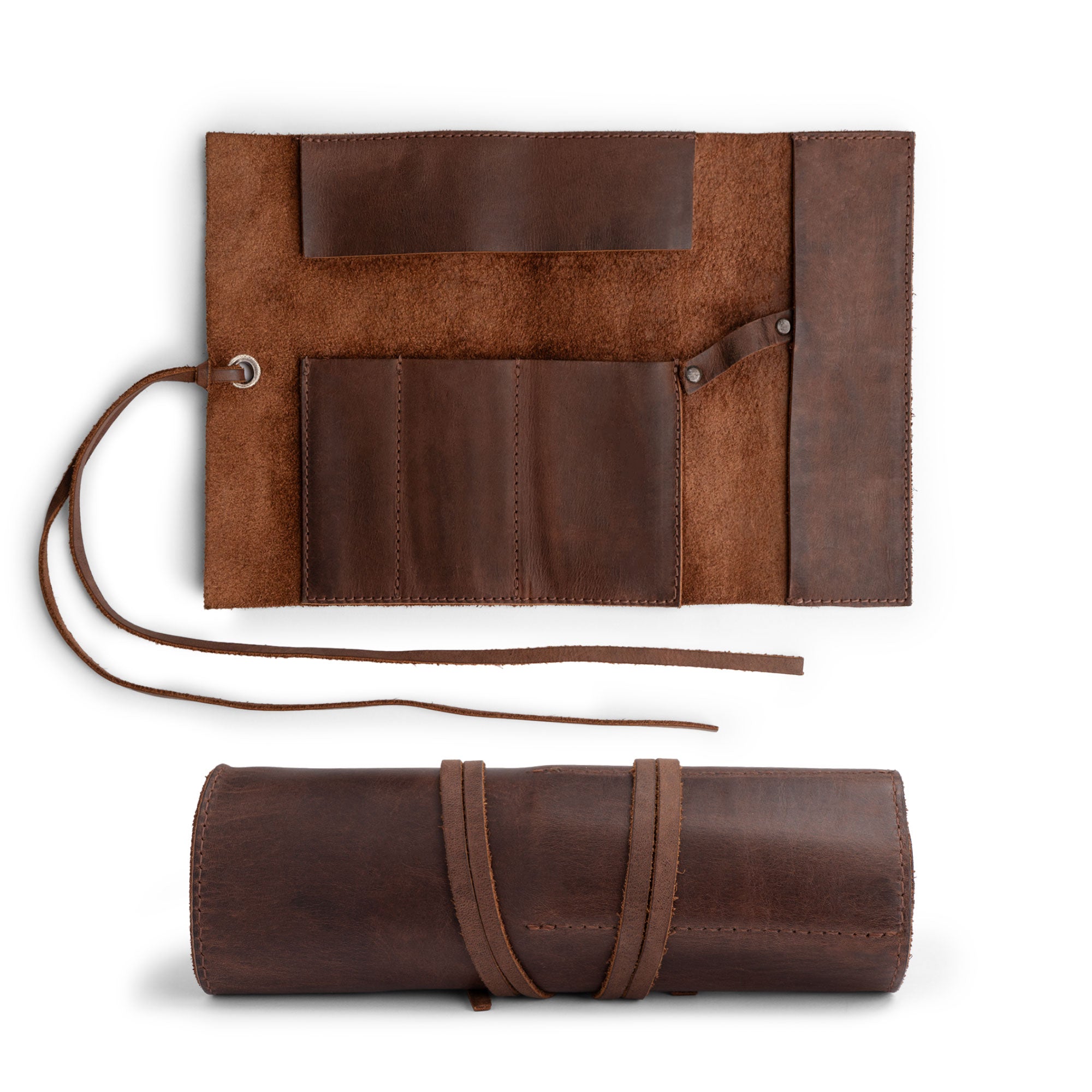 Hide & Drink Multi Purpose Pencil Roll displayed in an open position revealing its practical layout. Ideal for organizing work tools or craft supplies, this organizer is made from durable Full Grain Leather, emphasizing rustic charm and handmade artistry in a small batch production.