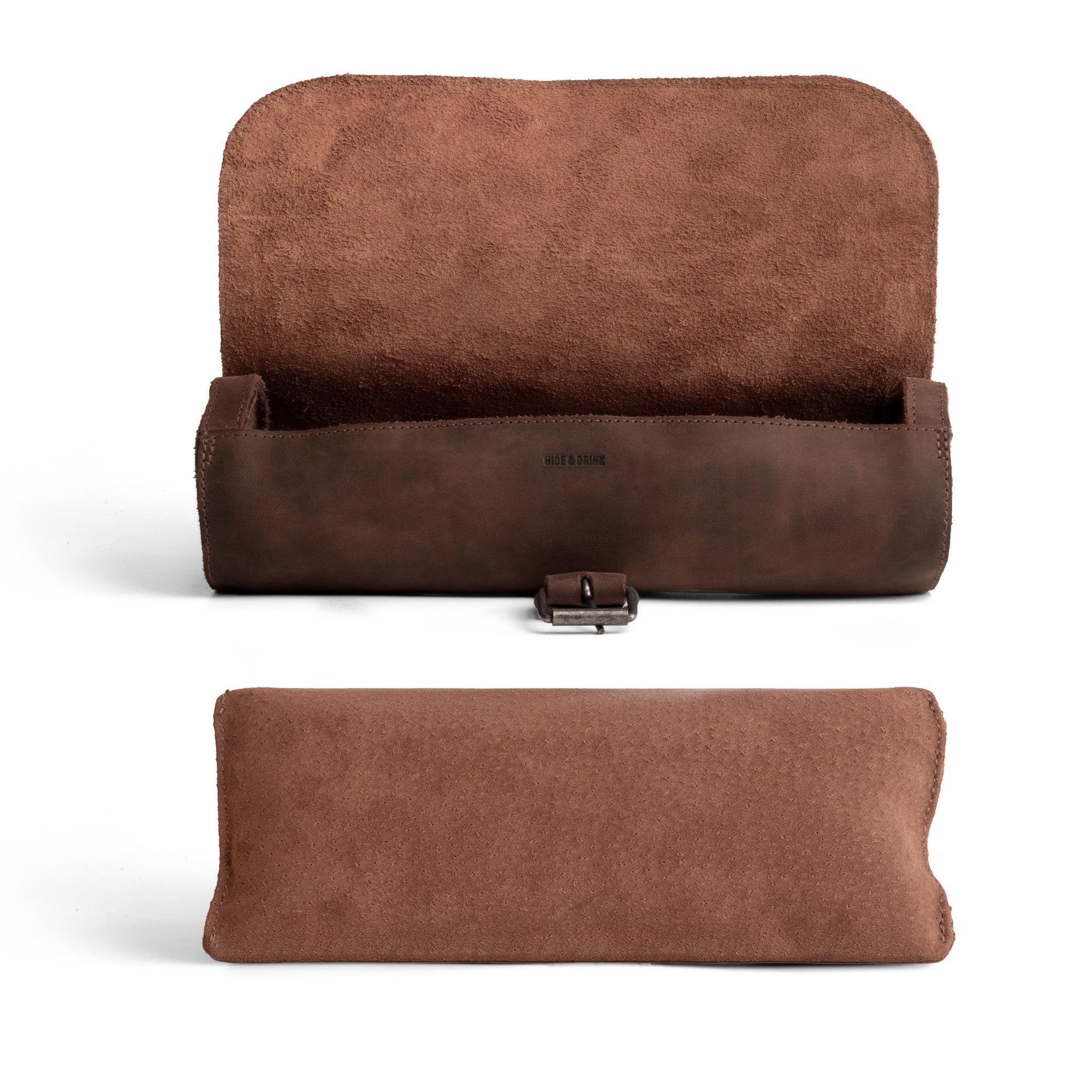 An elegant view of the Hide & Drink Cylinder Watch Case, featuring a smooth interior designed to comfortably hold your watches. Made from premium Full Grain Leather, this travel accessory serves as a chic jewelry roll organizer. Each case showcases quality small batch production, with everything hand cut and hand sewn by artisans in La Antigua Guatemala & Oaxaca Mexico.