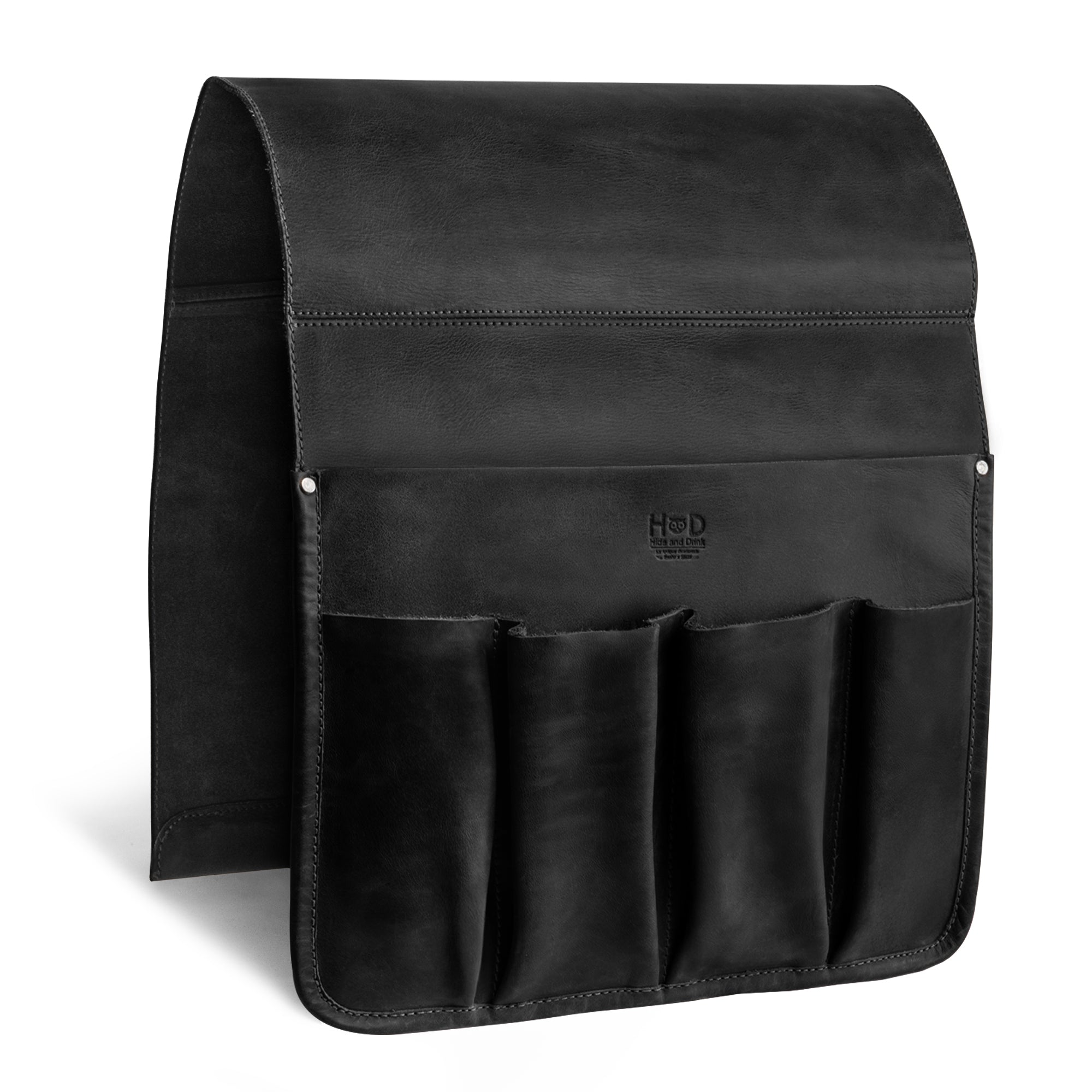 Hide & Drink's Remote Control Holder displaying its detailed measurements, providing insight into its design meant for holding remotes and magazines securely. An excellent choice for an organized living space, crafted with care by artisans in La Antigua Guatemala.