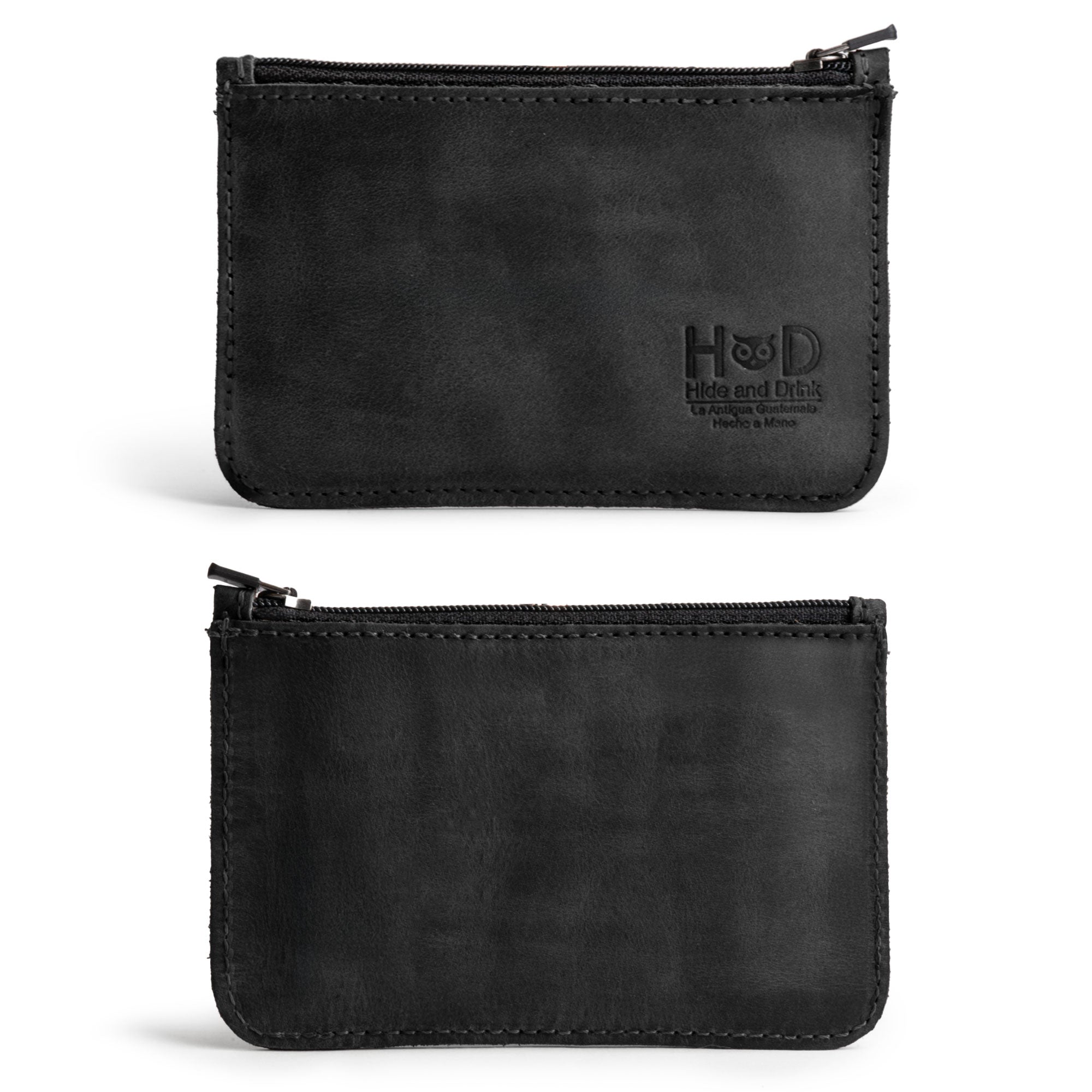Front view of a black Hide & Drink zippered wallet showcasing its sleek and practical design. This wallet serves as a coin organizer and folded bills storage, reflecting the artisanal quality and handmade uniqueness of products made in La Antigua Guatemala and Oaxaca Mexico.