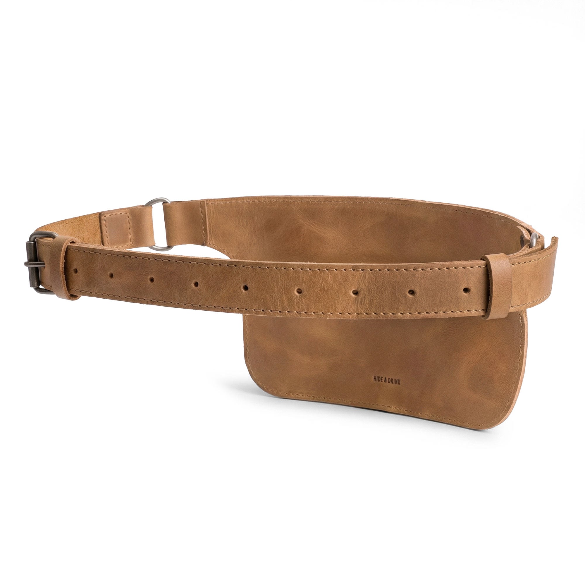 Slim Fanny Pack by Hide & Drink displayed showing sleek lines and a compact size, perfect for carrying essentials while on the go. This handmade accessory crafted from full grain leather is designed for durability and style.
