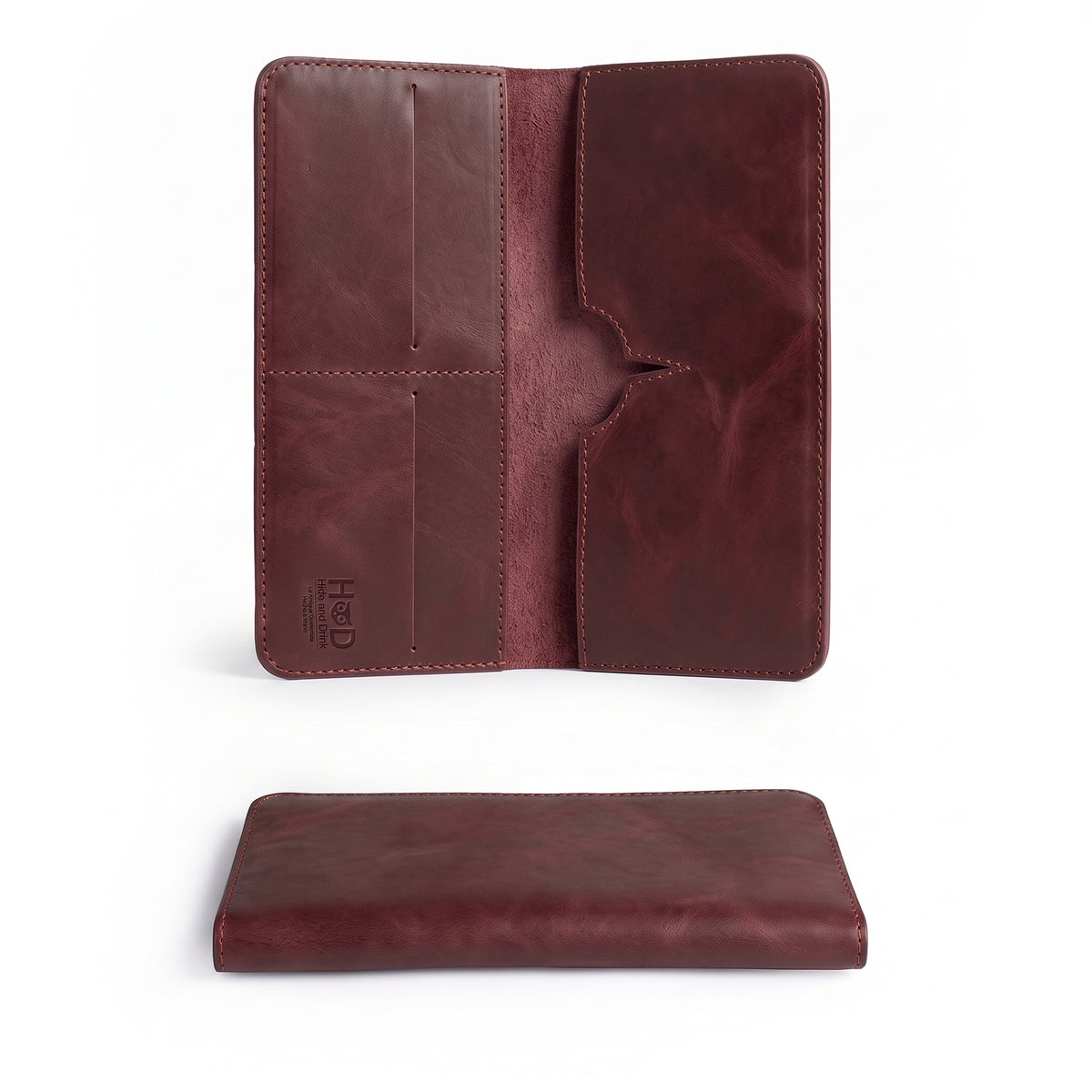 Exterior view of the closed red bifold wallet for cellphone by Hide & Drink, crafted with care. This Bifold Wallet for Cellphone highlights the beauty of Full Grain Leather, ensuring durability. Proudly made through small batch production, this artisan wallet is crafted in La Antigua Guatemala & Oaxaca Mexico.