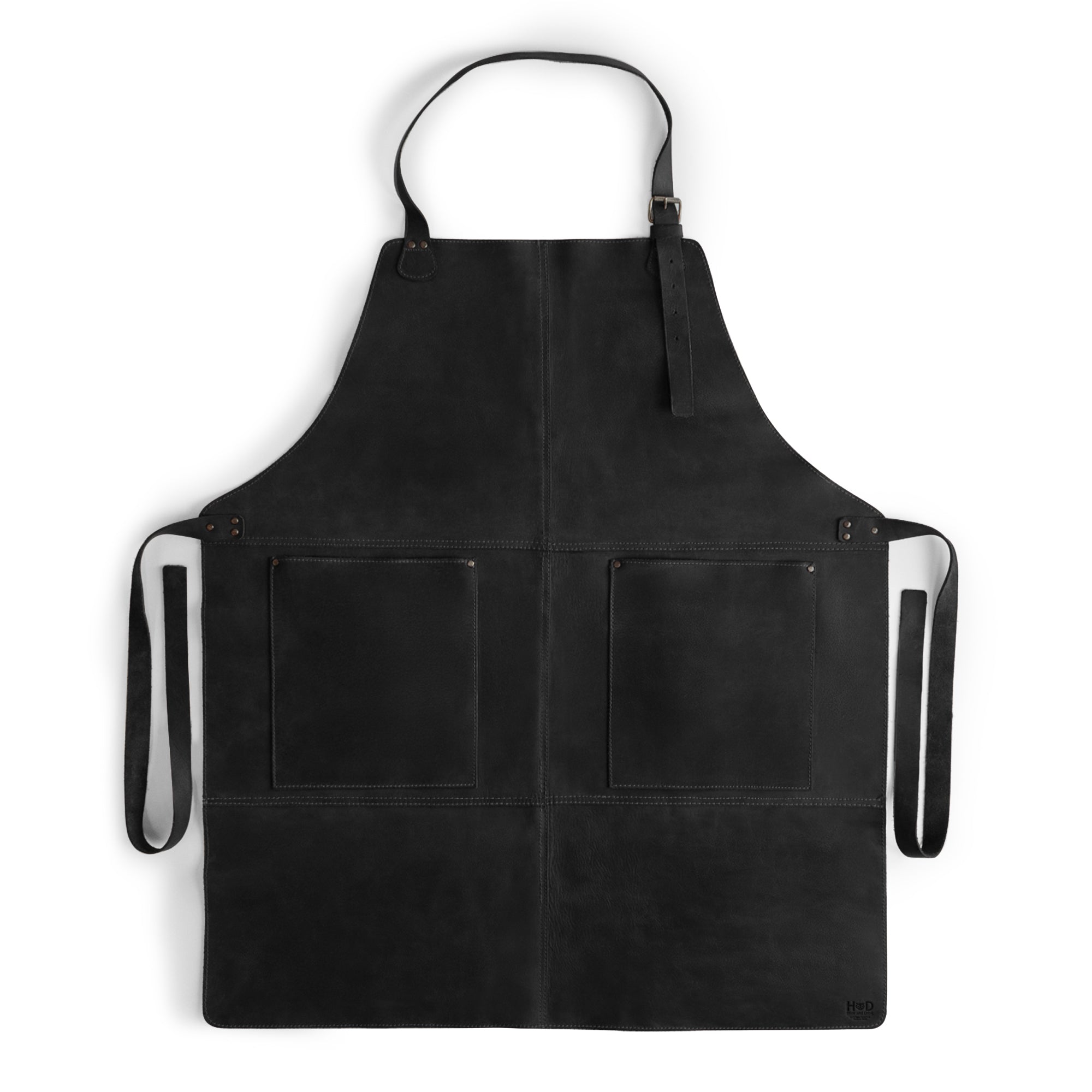 Front view of the Hide & Drink Leather Apron in black, featuring large pockets for tools and an adjustable strap system. A must-have Leather Apron, handcrafted with the finest full grain leather.