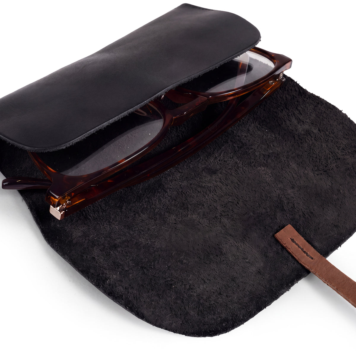 Hide & Drink Sunglass Wrap serves as a stylish and functional eye glasses storage. Crafted from full grain leather, it protects your sunglasses during travel. Artisan made, hand cut, and sewn in La Antigua Guatemala.