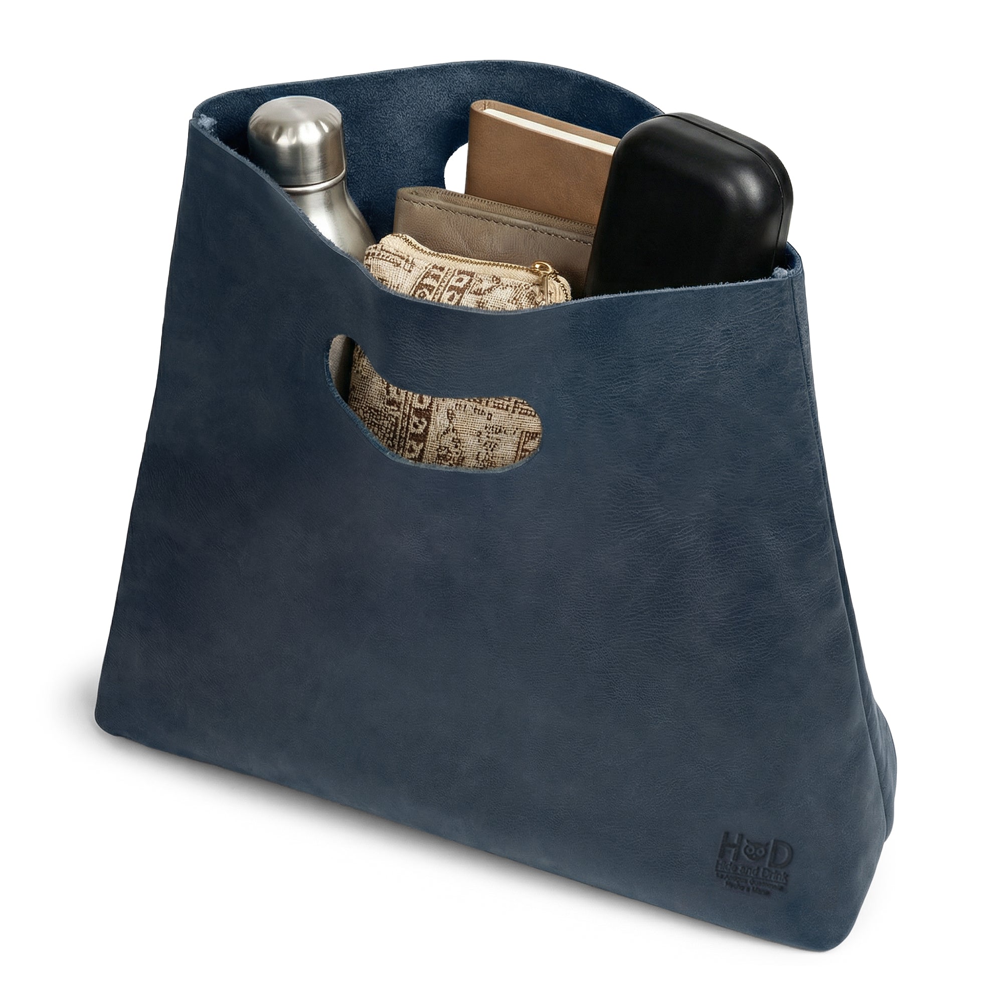 Close-up of the rim of the Hide & Drink Minimalist Boho Handbag in blue leather, demonstrating its fine stitching. This durable rustic purse is perfect for daily use, made from Full Grain Leather in La Antigua Guatemala & Oaxaca Mexico.