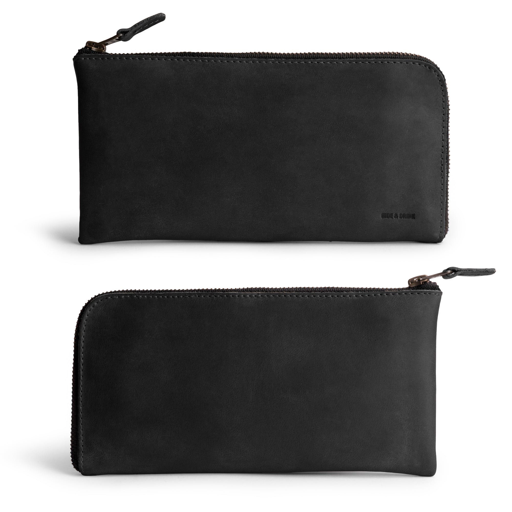 Front view of the Large Zippered Wallet by Hide & Drink in sleek Charcoal Black. This Long Zippered Wallet for Men and Women serves as a Card Holder, Card Organizer, and Bill Holder, making it a sophisticated Travel Accessory. Crafted from durable Full Grain Leather with artisan quality in La Antigua Guatemala & Oaxaca Mexico.