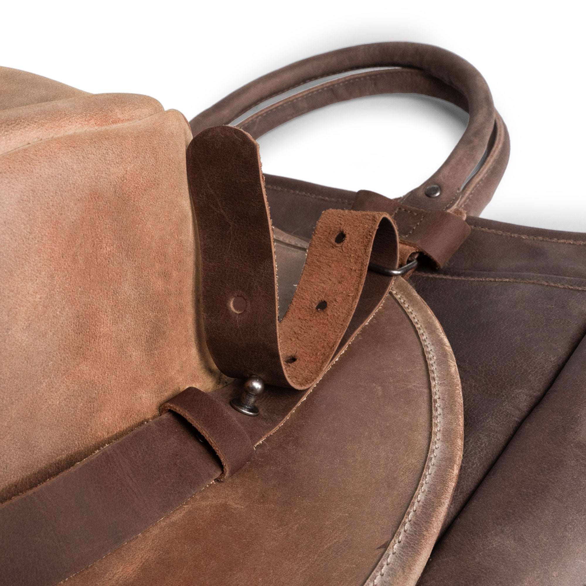 Close-up of the Travel Hat Harness by Western Leather Works, highlighting its sturdy full grain leather and unique fastening system. This hat harness is ideal for transporting hats in style, making it a perfect hat holder for travel with versatility for use with totes, backpacks, and luggage, all crafted using artisan techniques.