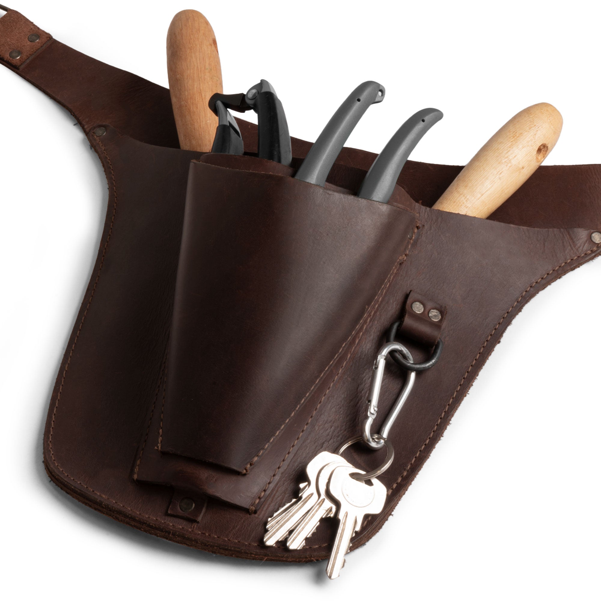 Close-up of Hide & Drink's Florist Tool Belt, featuring pockets for tools crafted from premium Full Grain Leather. This Florist Tool Belt for Men & Women is designed for comfort and practicality, perfect for gardening and various crafts. Hand sewn and fire branded, it's an artisan piece made in La Antigua Guatemala & Oaxaca Mexico.