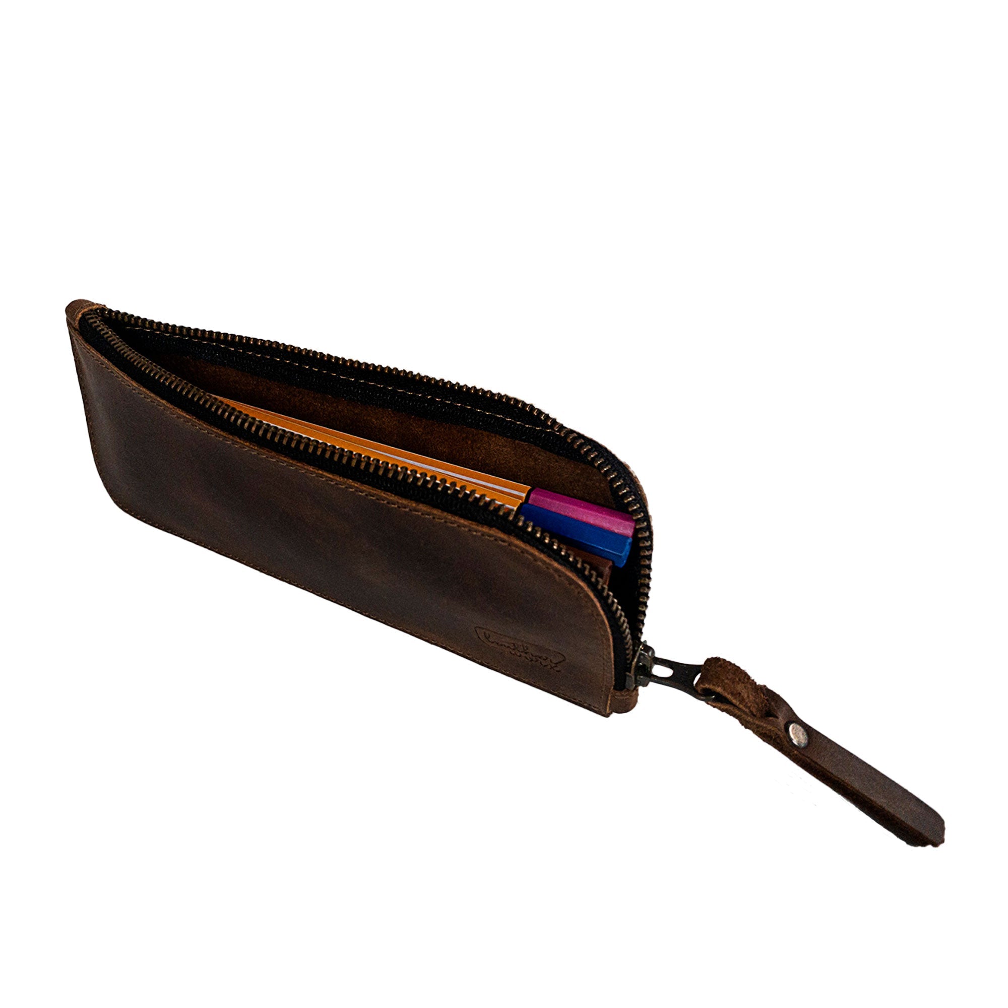 Open view of the Leather Worx Flat Pen Case, showing its interior designed for pens and markers. This curved pen and marker case is perfect for men and women and showcases the artisan touch of full grain leather, handmade in La Antigua Guatemala & Oaxaca Mexico.