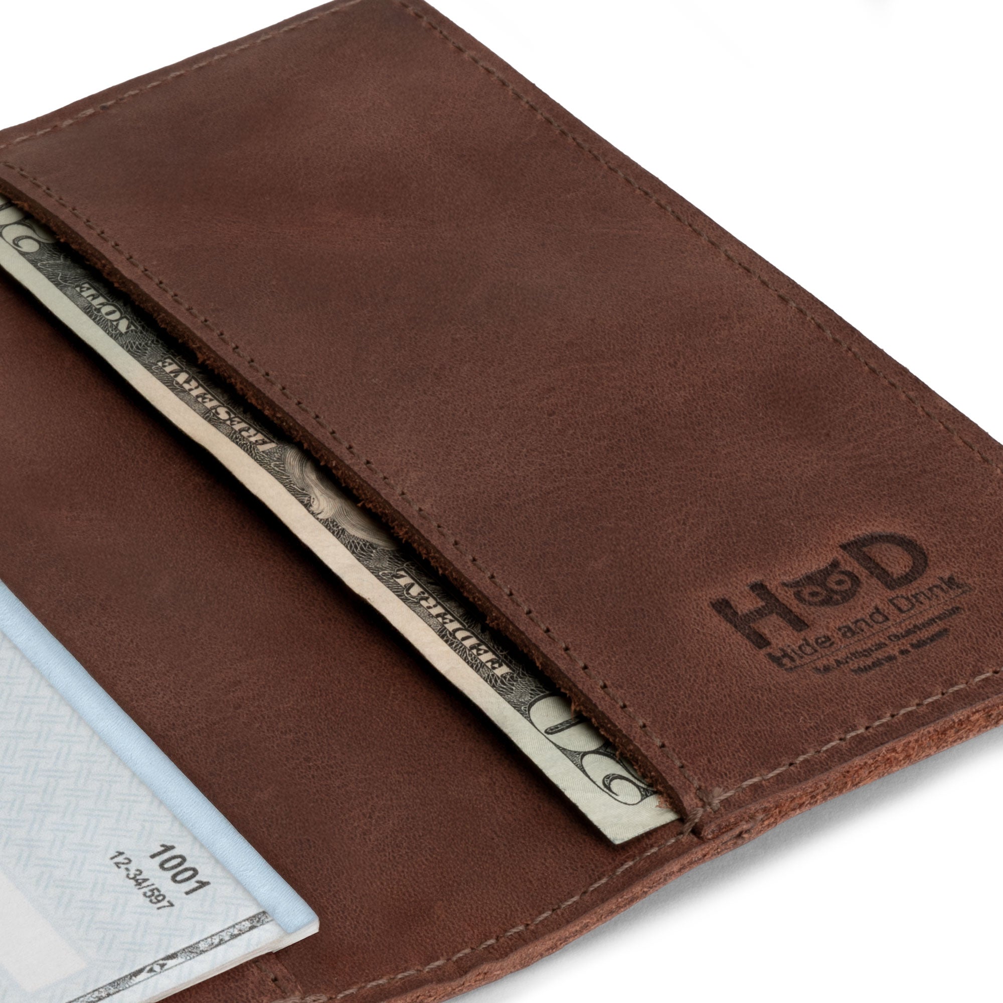 Close-up of the Checkbook Leather Cover by Hide & Drink, highlighting its design as a minimalist organizer for standard checkbooks. Made from full grain leather, this handmade item showcases artisan quality, created in La Antigua Guatemala and Oaxaca Mexico through small batch production.