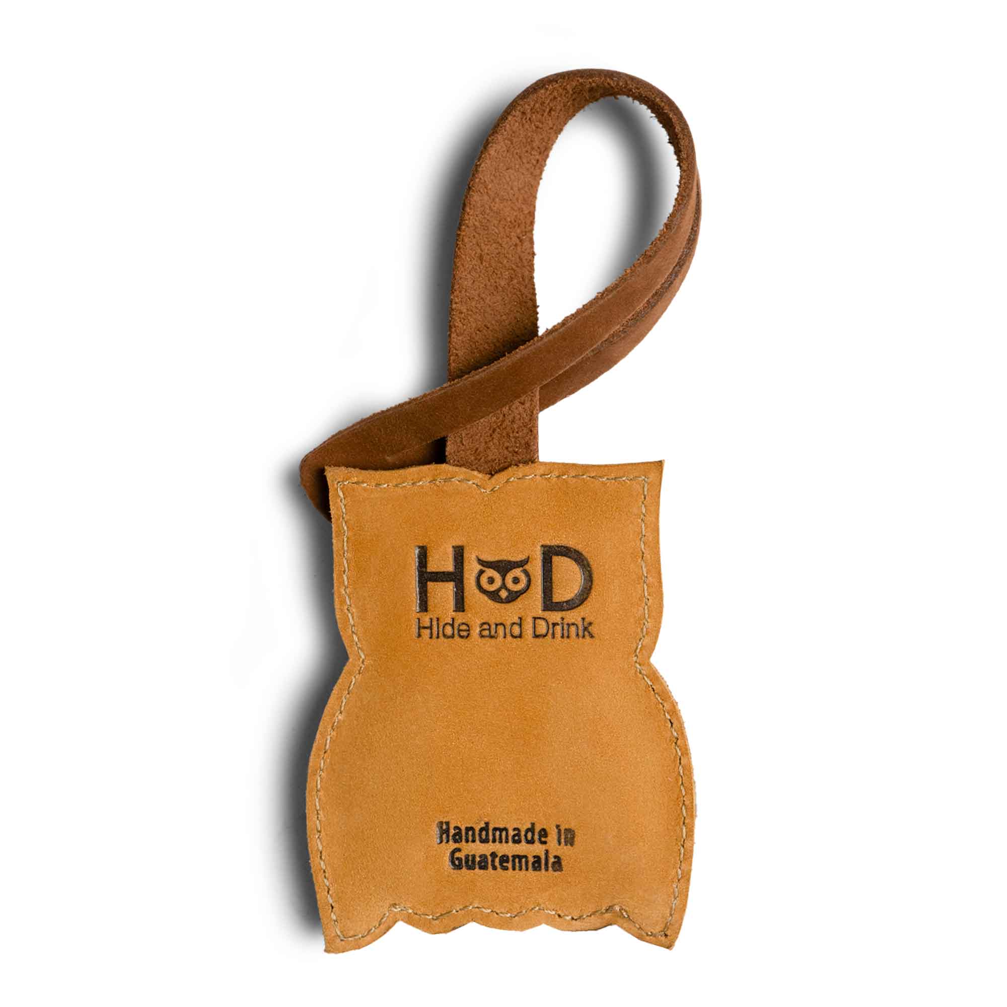 Hide & Drink Bag Charms displaying a unique fox design, ideal charm for handbags. This accessory doubles as a purse charm for tote & backpacks crafted from durable full grain leather. Signifying StockyardX's small batch production methods, each piece features hand cut, hand sewn artistry and fire branding, handmade in La Antigua Guatemala & Oaxaca Mexico.