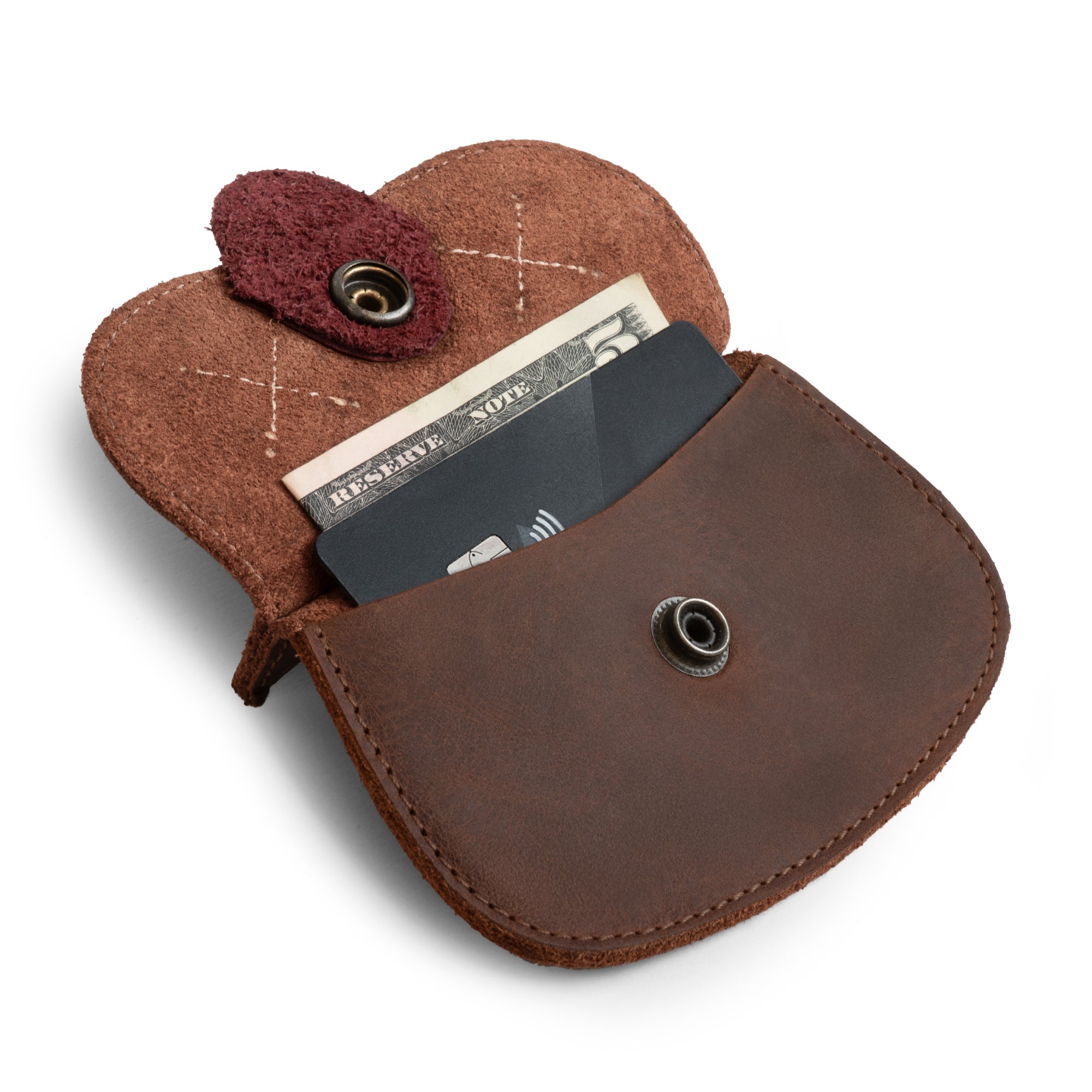 Hide & Drink Leather Cat Wallet displayed open with coins visible. This Full Grain Leather Cat-Shaped Wallet is an ideal Coin Pouch and Money Holder, handmade with craftsmanship in La Antigua Guatemala & Oaxaca Mexico.