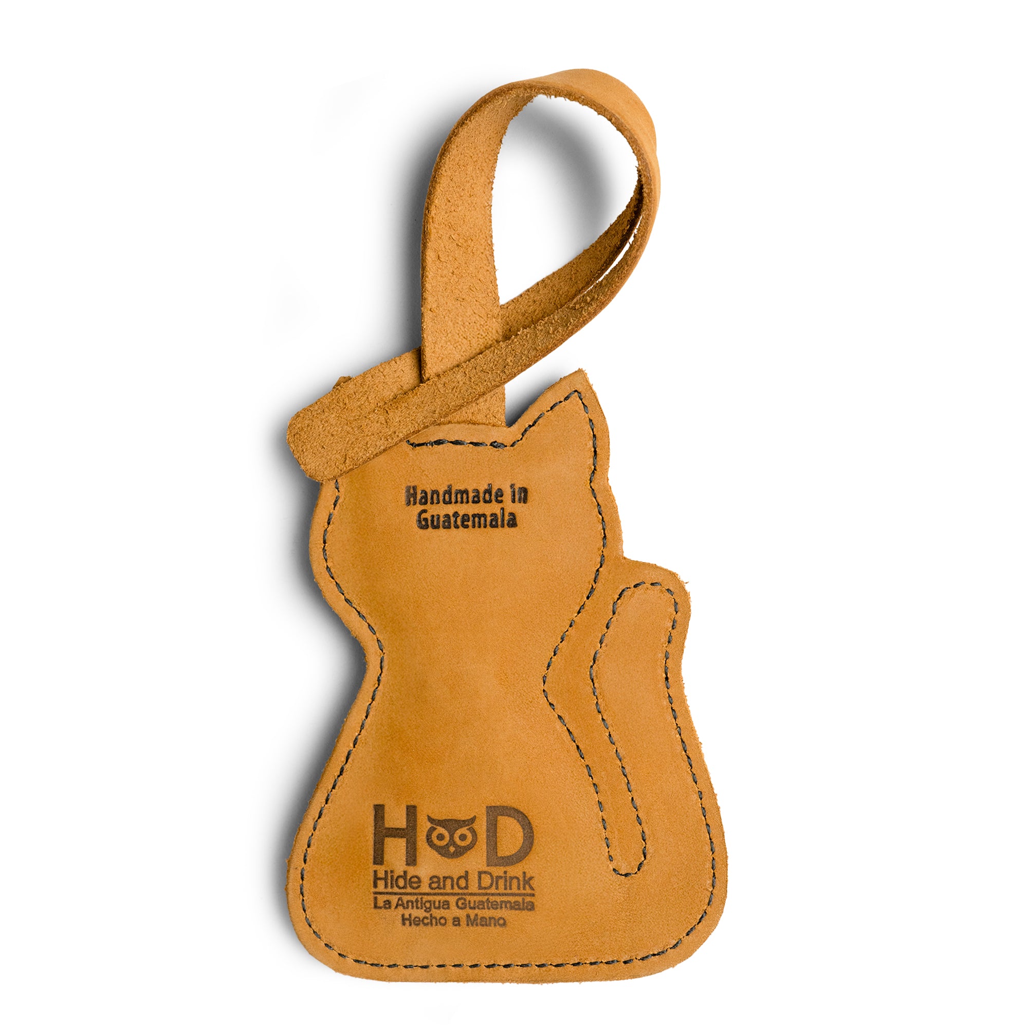 Hide & Drink Bag Charms featuring a playful nose design, making it a lovely charm for handbags. Ideal as a purse charm for tote & backpacks crafted from premium full grain leather. This piece is a testament to StockyardX's small batch production approach, showcasing hand cut and hand sewn artistry with fire branding, handmade in La Antigua Guatemala & Oaxaca Mexico.