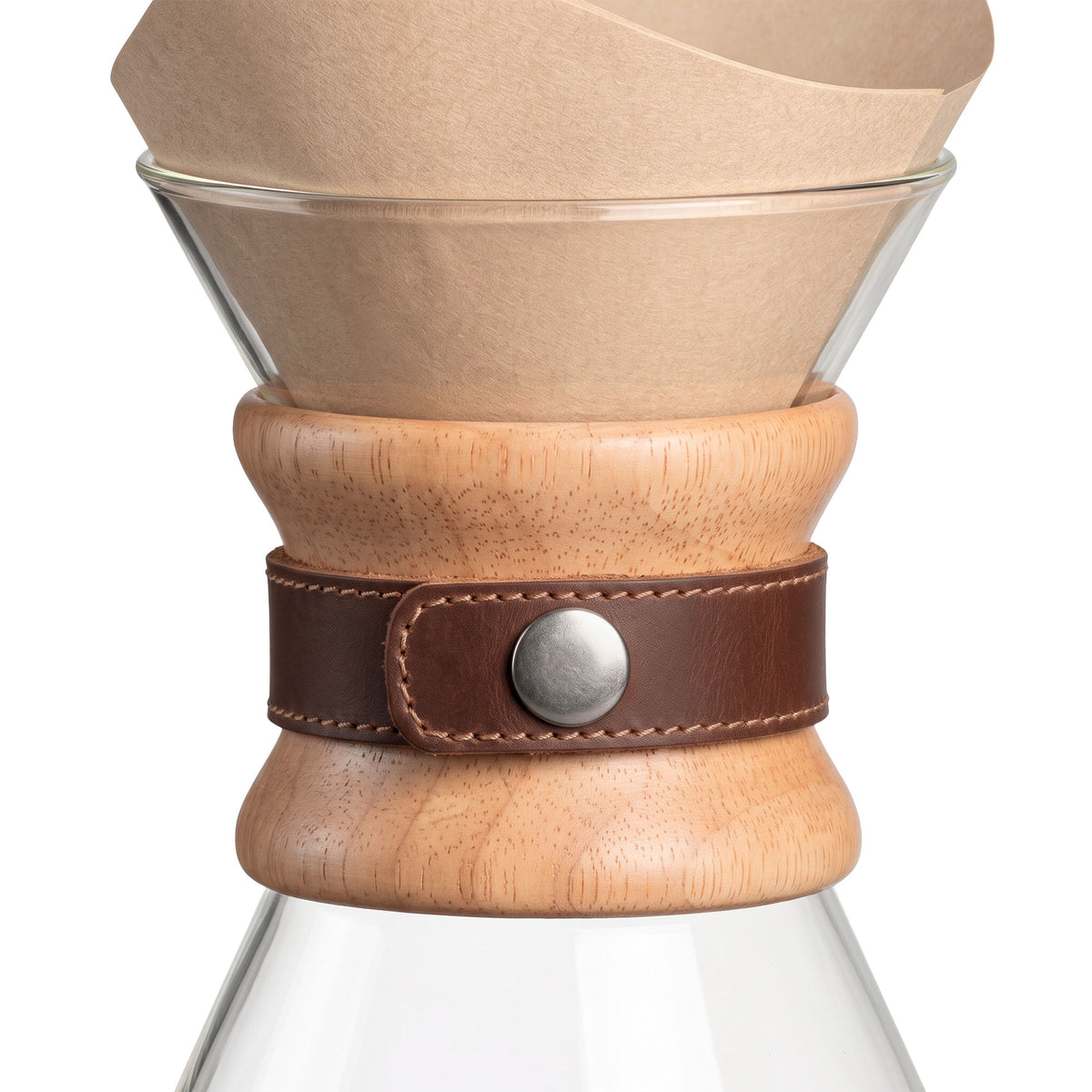 The Chemex coffee maker elegantly displayed with the Hide & Drink Chemex Strap Replacement. This strap adds a touch of durability and style while securely holding the collar. Pour Over Strap (2 Pack) Compatible with Chemex 6-Cup Glass, crafted from Full Grain Leather, showcasing artisan quality through small batch production, hand cut and hand sewn, fire branded in La Antigua Guatemala & Oaxaca Mexico.