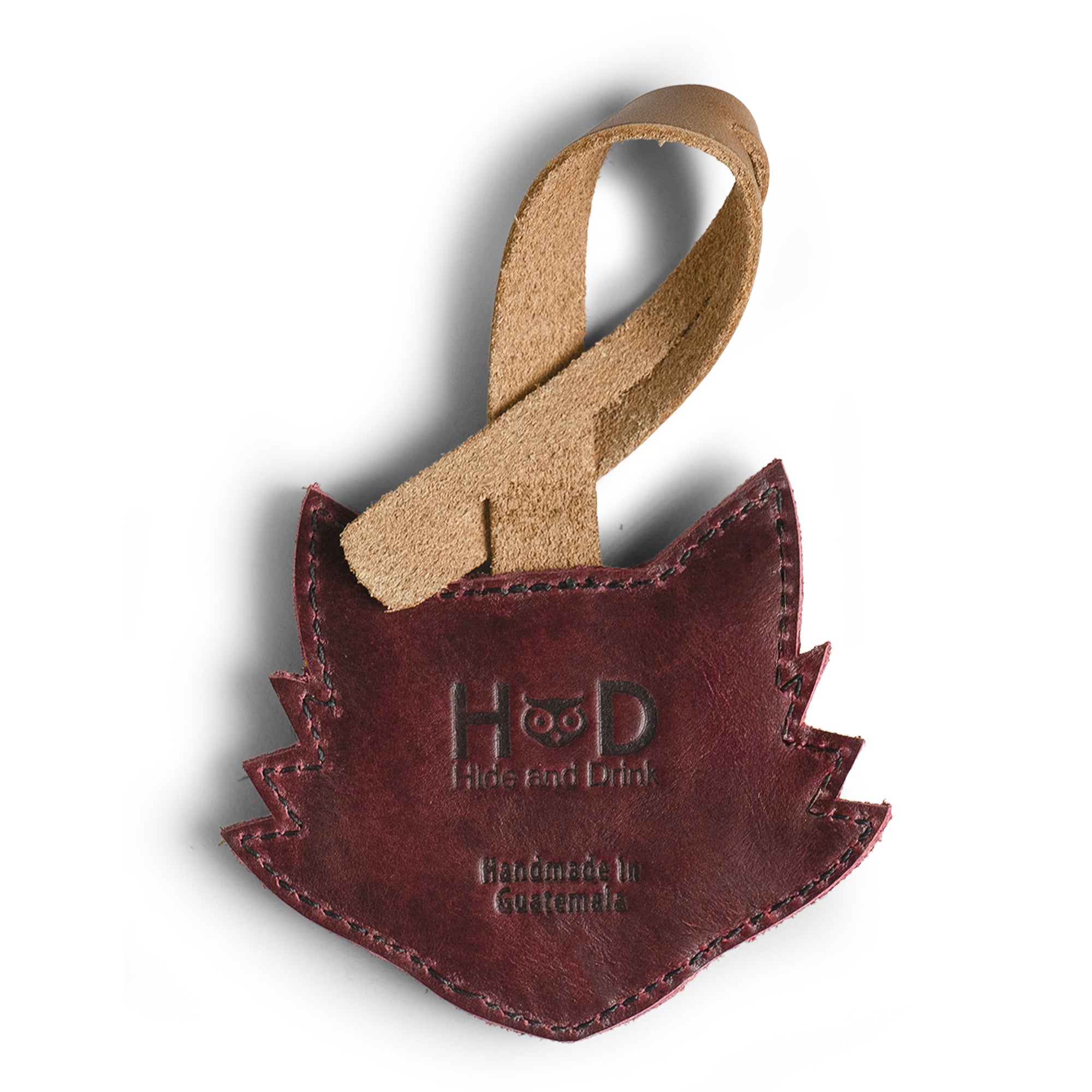 Hide & Drink Bag Charms displaying a delightful ladybug design, the perfect charm for handbags. This purse charm for tote & backpacks made from durable full grain leather signifies StockyardX's commitment to small batch production. Each piece captures hand cut, hand sewn artistry and fire branding, handmade in La Antigua Guatemala & Oaxaca Mexico.