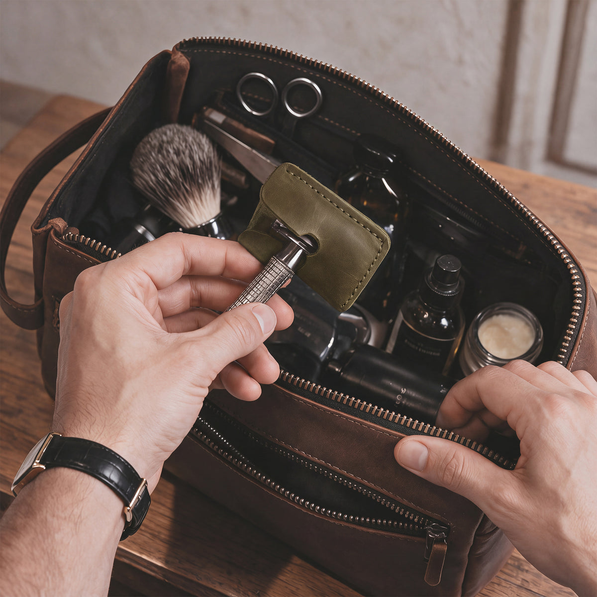Razor Head Cover by Hide & Drink in action, showing the double edge safety razor fitted snugly into the full grain leather protective sheath, emphasizing its handcrafted quality perfect for shaving on the go.