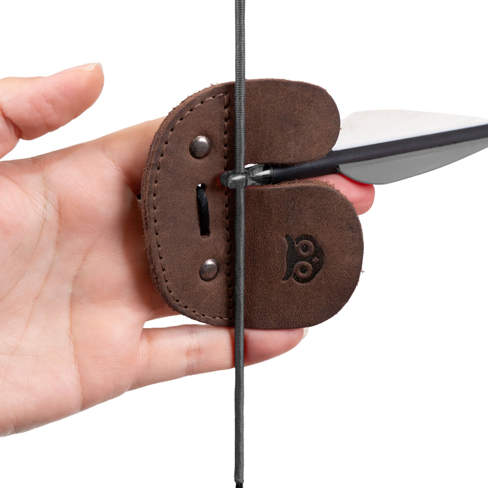 Close-up of the Hide & Drink Left Handed Archery Finger Protector in action. This Archery Finger Tab is the ultimate Protect Guard for Recurve Bows, featuring exquisite Full Grain Leather. Ideal for shooting practice gear in sports and outdoors, it's a handmade item from StockyardX with small batch production quality you can trust.