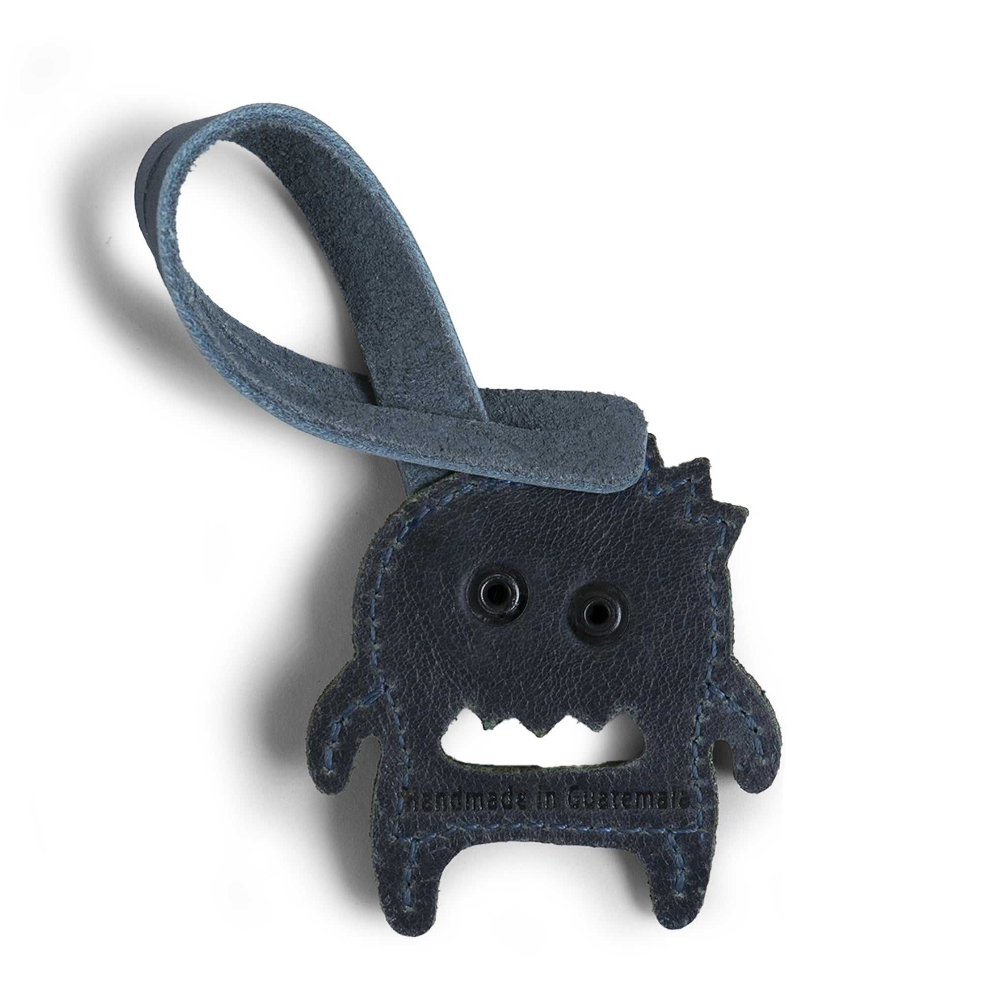 Hide & Drink Bag Charms displaying a beautifully designed skull with flowers, an ideal charm for handbags. This purse charm for tote & backpacks made from premium full grain leather signifies StockyardX's small batch production ethos. Each piece showcases hand cut, hand sewn craftsmanship and fire branding, handmade in La Antigua Guatemala & Oaxaca Mexico.