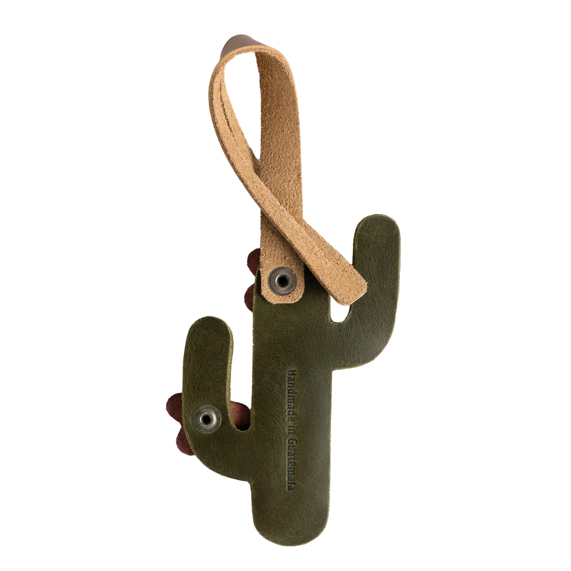 Bag Charms by Austin Genuine shows a cactus charm with a label 'Handmade in Guatemala.' This Austin Genuine Bag Charm showcases 7 unique designs made with full grain leather from StockyardX, crafted through small batch production, hand cut, hand sewn, and fire branded, artisan, handmade in La Antigua Guatemala & Oaxaca Mexico.