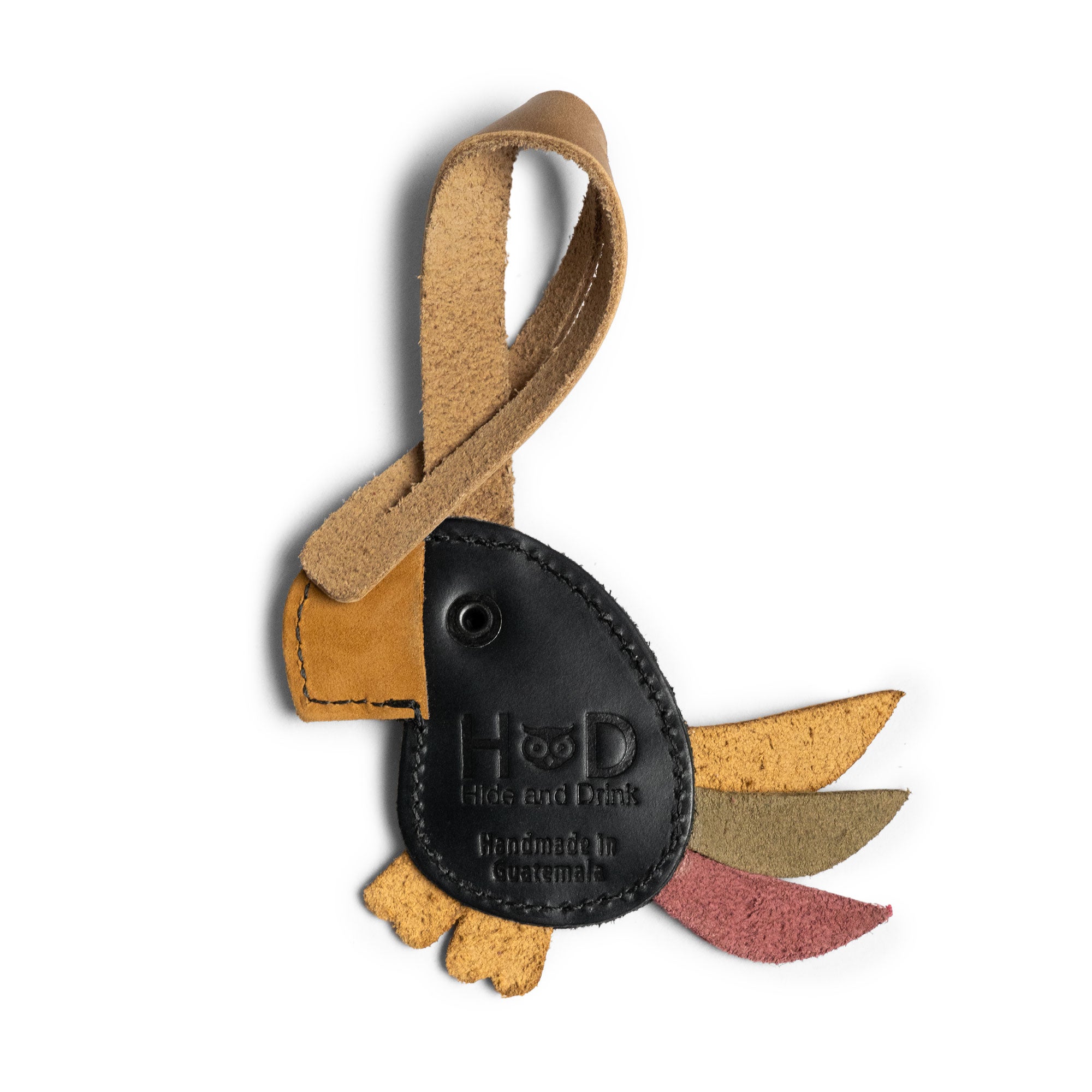 Hide & Drink Bag Charms displaying a unique luchador mask design, perfect charm for handbags. This purse charm for tote & backpacks crafted from premium full grain leather signifies StockyardX's small batch production methods. Each piece features hand cut, hand sewn craftsmanship and fire branding, handmade in La Antigua Guatemala & Oaxaca Mexico.