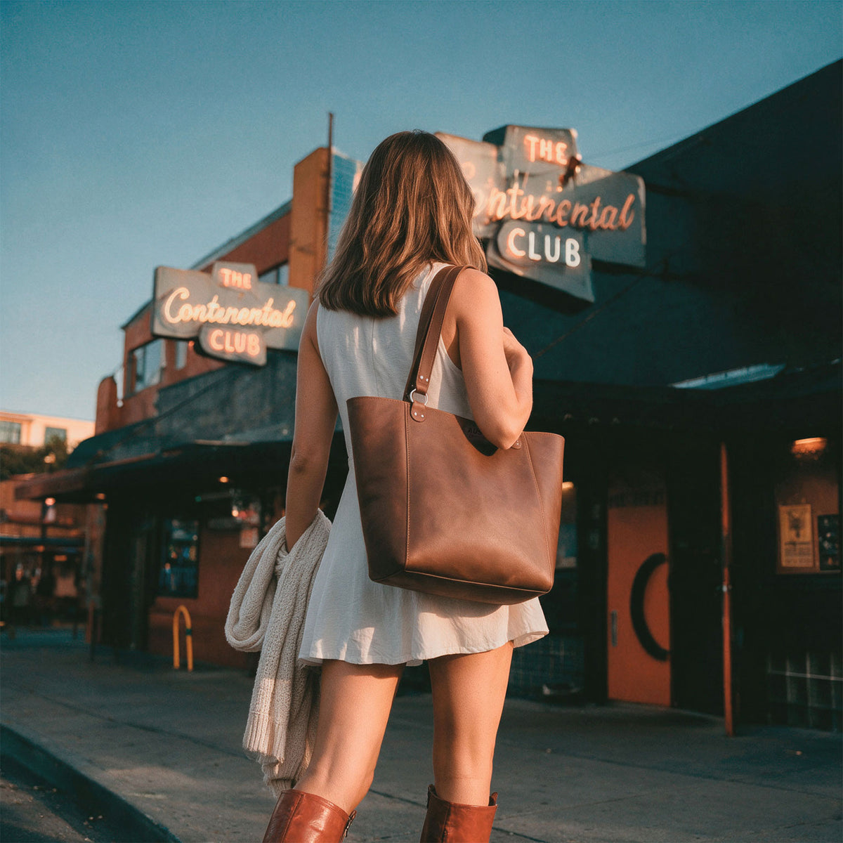 Austin Genuine Formal Handbag shown from above with a roomy interior holding a laptop, wallet, notebook, and accessories; a practical Formal Tote Bag and Female Bag for Travel and Shopping, made as a Handbag for Women. Formal Handbag, Full Grain Leather, StockyardX, Small Batch Production, Hand Cut, Hand Sewn, Fire Branded, Artisan, Handmade in La Antigua Guatemala & Oaxaca Mexico.