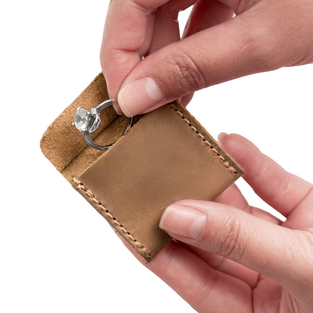 Beautifully crafted Hide & Drink Wedding Ring Case in soft full grain leather, providing an elegant way to store engagement rings. Ideal for travel and as a pouch organizer for jewelry, hand stitched with attention to detail by artisans in La Antigua Guatemala & Oaxaca Mexico.
