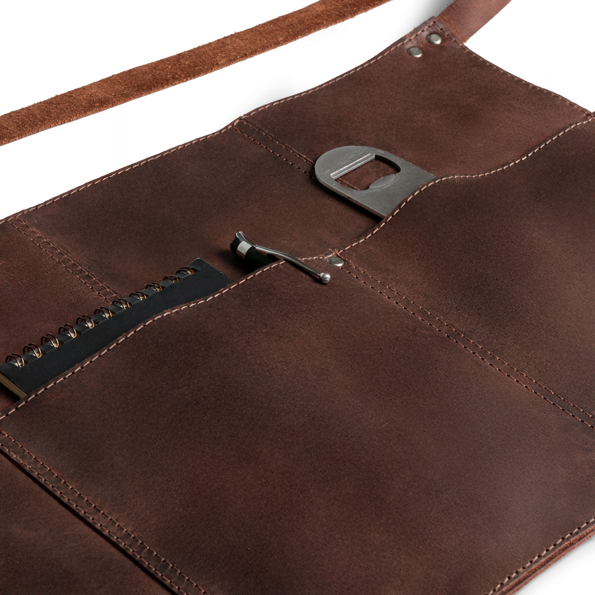 Close-up of Hide & Drink Barista Leather Waist Apron revealing riveted pockets and high-quality full grain leather, ideal for server shorts. Artisan-made in small batch production in La Antigua Guatemala & Oaxaca Mexico.
