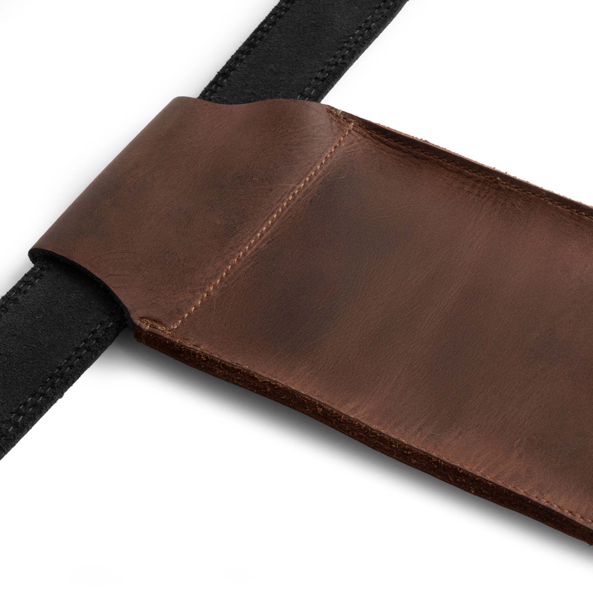 Close-up of the Hide & Drink Waist Phone Holder showcasing its Full Grain Leather construction, a perfect Cellphone Sleeve with Belt Loop for Waist, designed to securely protect your phone. This Handmade product from artisans in La Antigua Guatemala & Oaxaca Mexico is meticulously hand cut and hand sewn, ensuring a durable design that exudes quality.