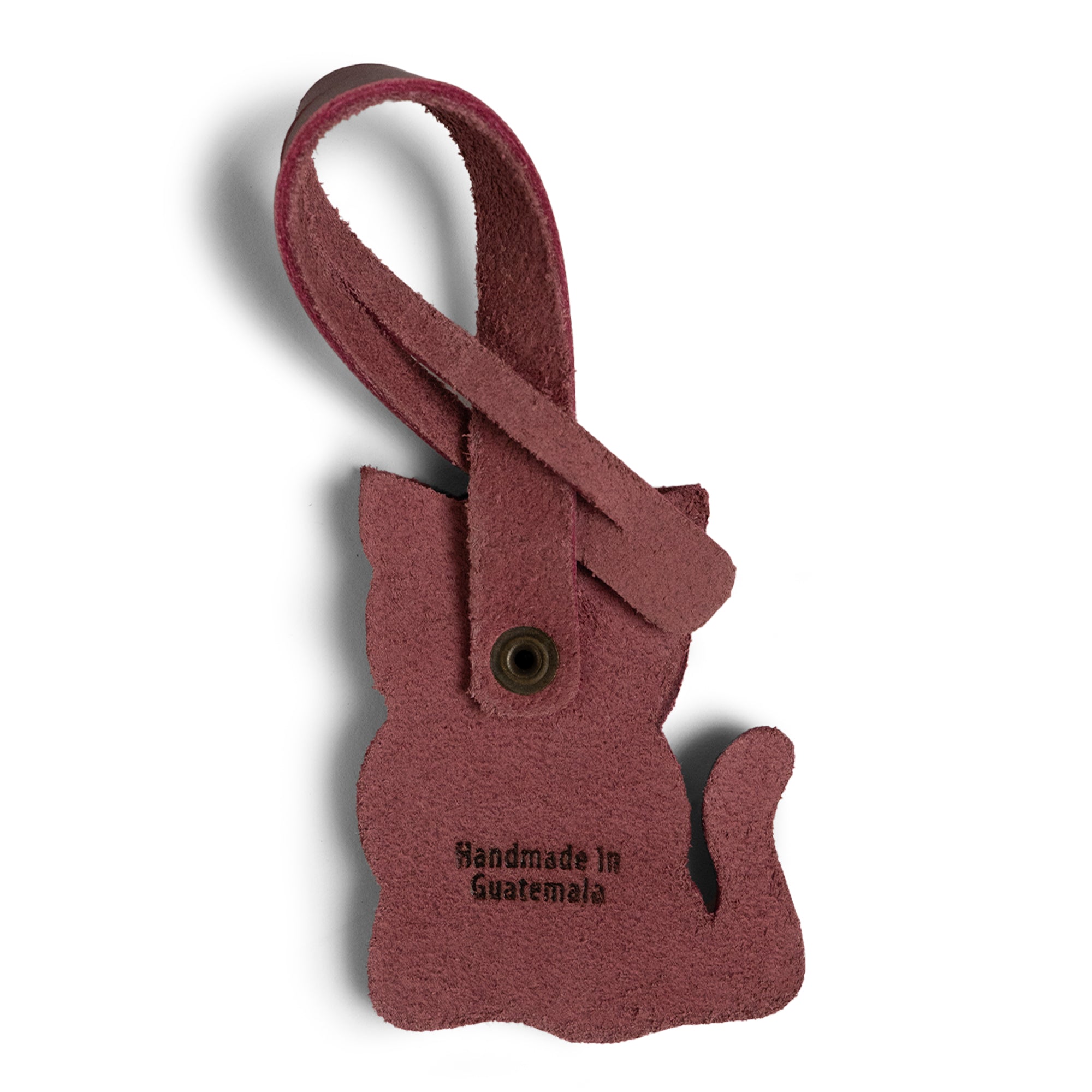 Hide & Drink Bag Charms displaying a charming cat design, ideal charm for handbags. Ideal as a purse charm for tote & backpacks made from durable full grain leather. Each piece reflects StockyardX's small batch production ethos, showcasing hand cut, hand sewn craftsmanship along with fire branding, handmade in La Antigua Guatemala & Oaxaca Mexico.