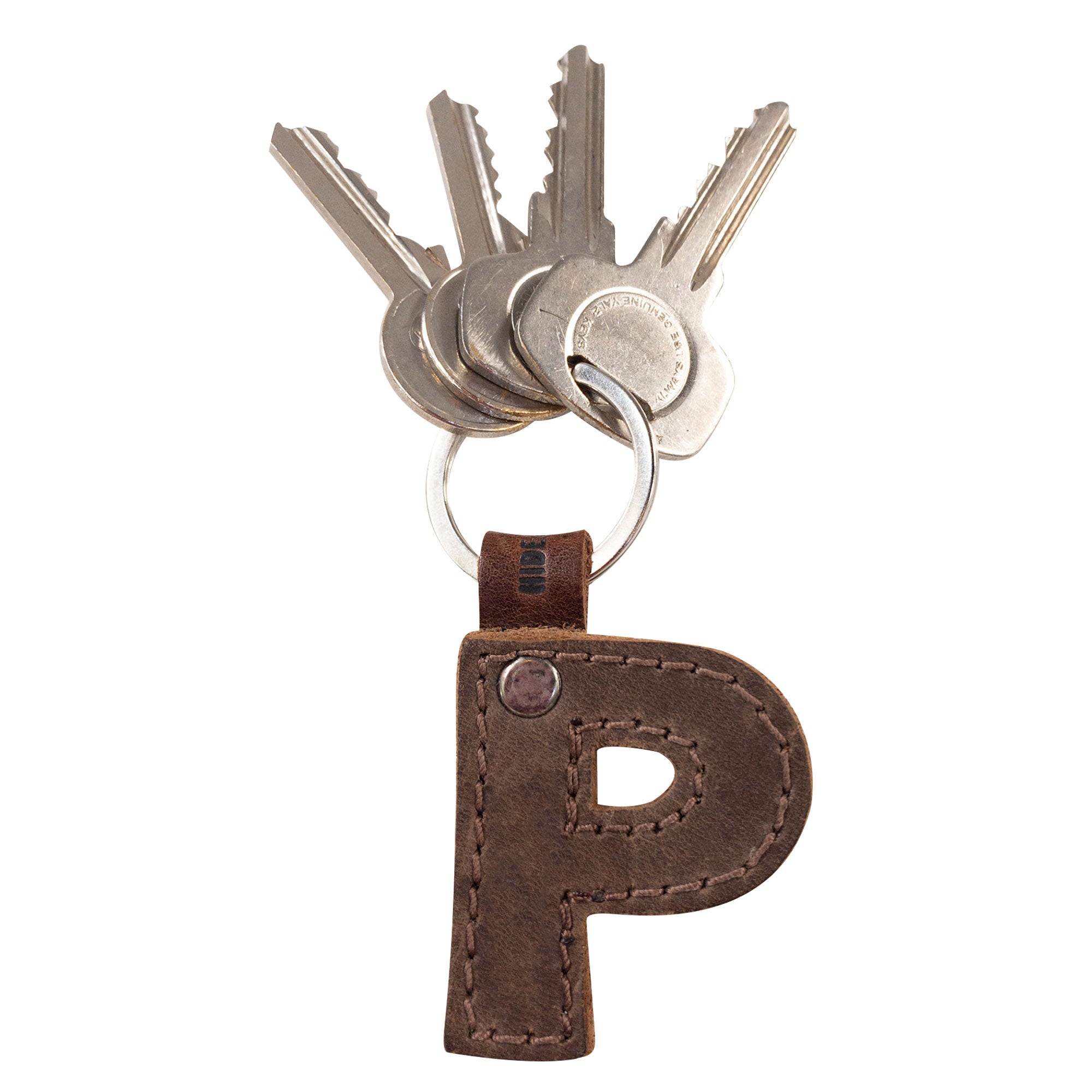 Image of the letter P in thick leather Alphabet Letter Keychain by Hide & Drink. This robust keychain is made from Full Grain Leather, representing the artisan's quality hand cut and hand sewn techniques from La Antigua Guatemala.