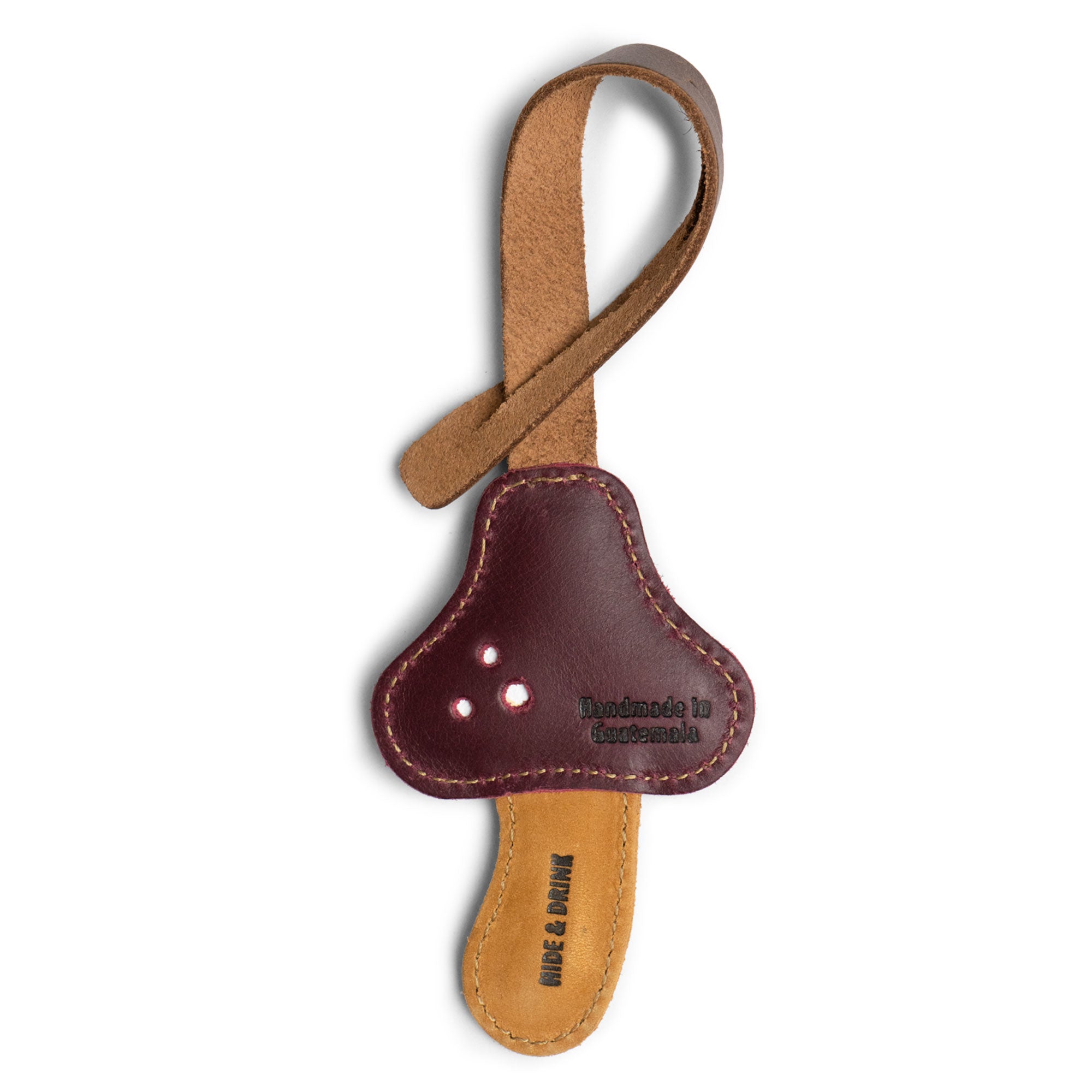 Hide & Drink Bag Charms displaying a lovely pineapple design, ideal charm for handbags. This accent piece works great as a purse charm for tote & backpacks crafted from high-quality full grain leather. Each piece embodies StockyardX's small batch production principles, showcasing hand cut, hand sewn artistry and fire branding, handmade in La Antigua Guatemala & Oaxaca Mexico.