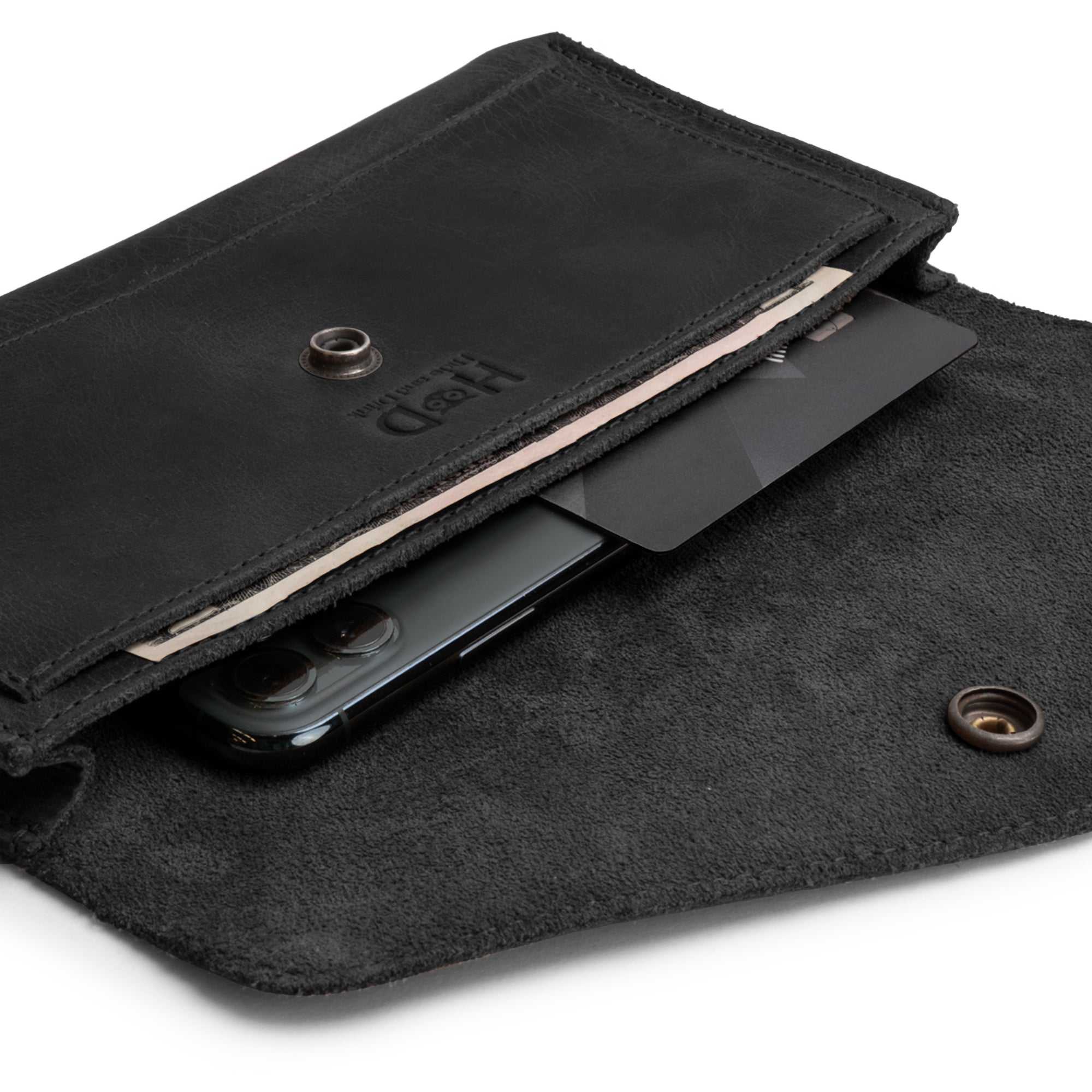 Close-up of the interior of the Large Female Wallet by Hide & Drink, featuring a pocket for cards and cash. This stylish Travel Organizer for Women is crafted from Full Grain Leather and reflects the artisan skills of small batch production.