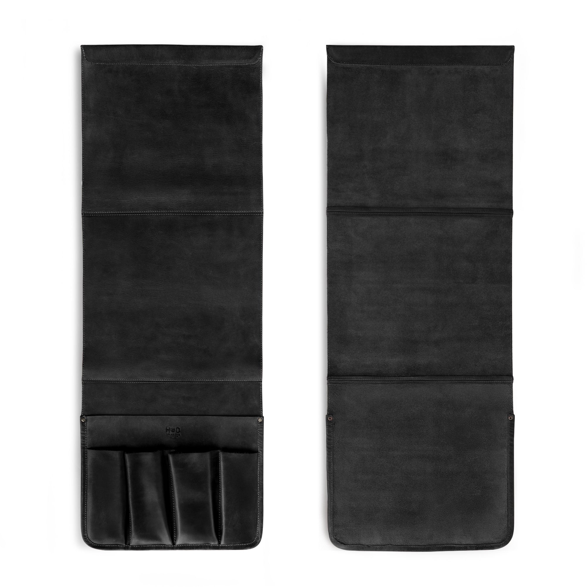 Folded view of Hide & Drink's Remote Control Holder in black leather, perfect for storing remotes and magazines effortlessly. This handmade item showcases the essence of couch potato essentials with its elegant design and sturdy craftsmanship.