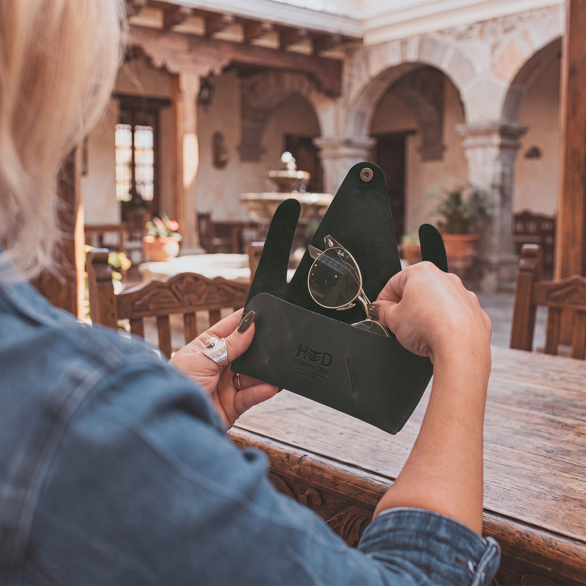 Inside view of the black Foldable Sunglass Case by Hide & Drink, ensuring perfect fit for sunglasses. Made from Full Grain Leather, it reflects the artisan quality and attention to detail through hand cutting and sewing.