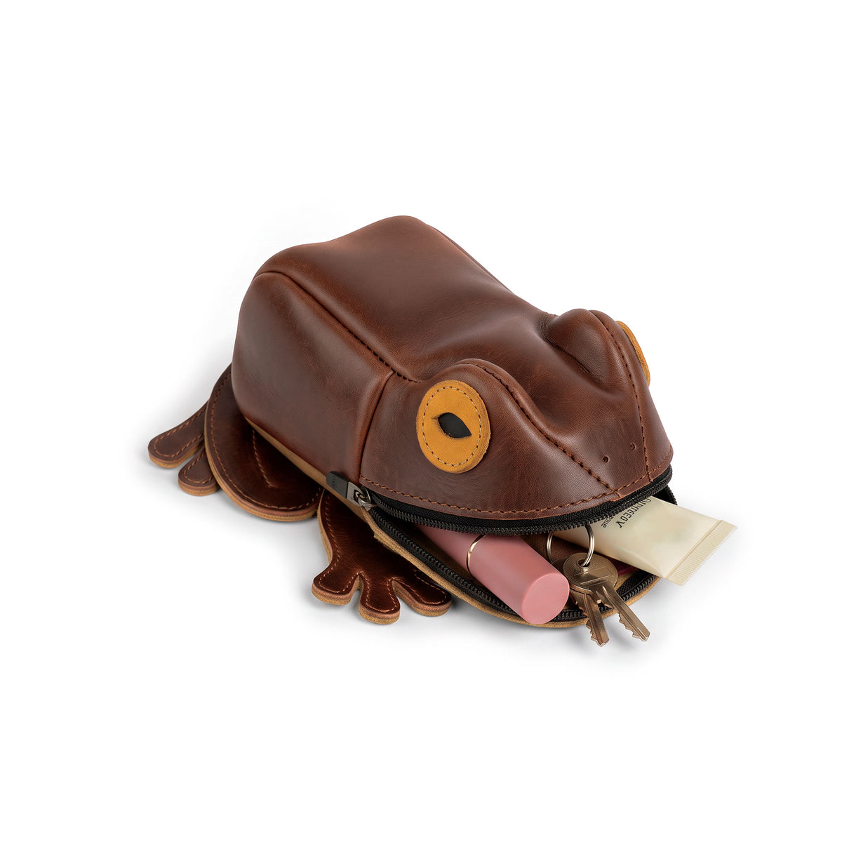 Open Tudi Frudi Frog Pouch displaying keys, cosmetics, and small essentials inside its frog-shaped compartment, a Frog-Shaped Pouch, Cable Organizer, and Small Accessory Case; Zippered Cash Holder Wallet for Coins and Change Purse, suitable for Pouches for Men and Women. Full Grain Leather design from StockyardX, made with Small Batch Production, Hand Cut and Hand Sewn, Fire Branded, Artisan, Handmade in La Antigua Guatemala & Oaxaca Mexico.