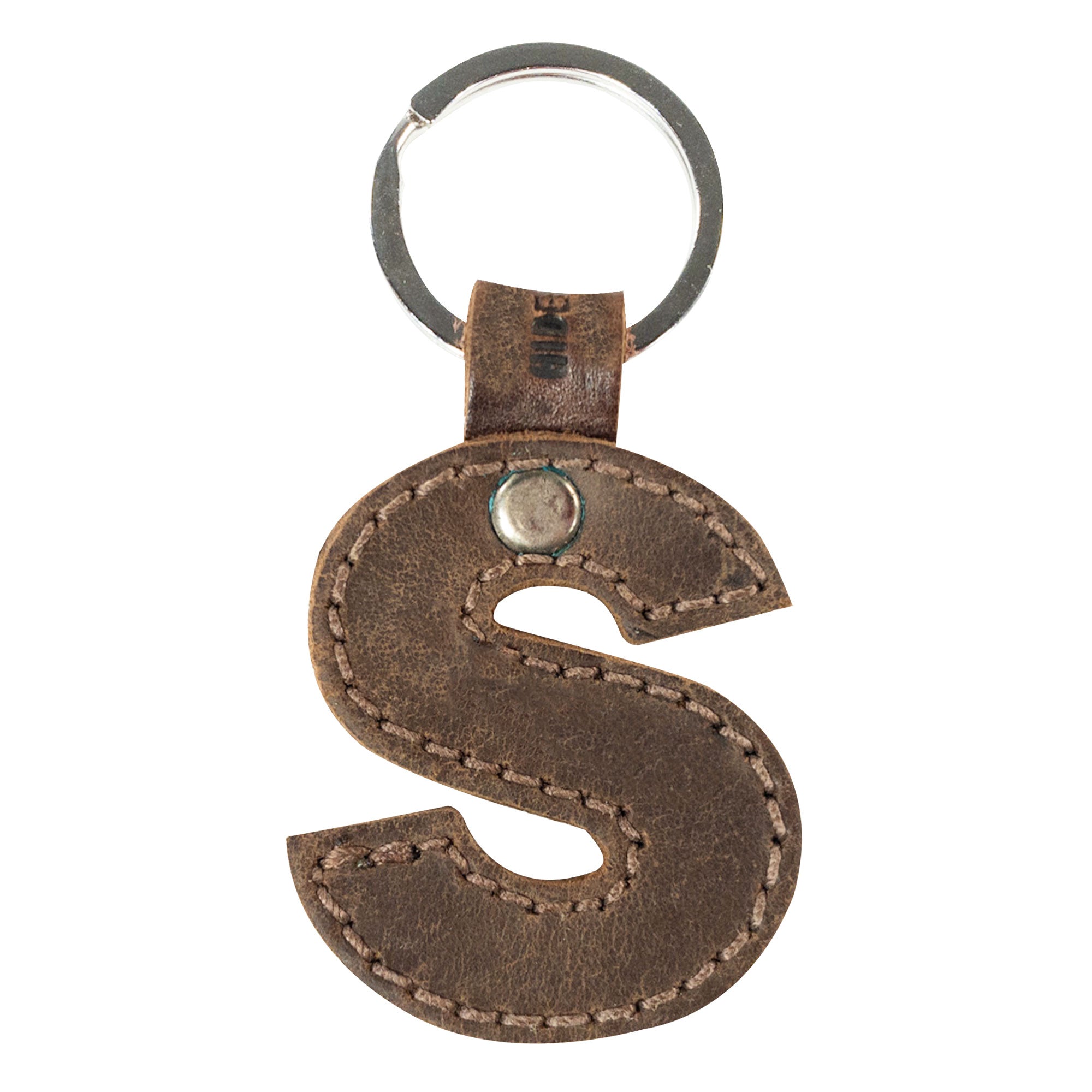 Letter S in thick leather Alphabet Letter Keychain showcased by Hide & Drink. This piece, made from Full Grain Leather, illustrates the artisan craftsmanship in small batch production from La Antigua Guatemala.