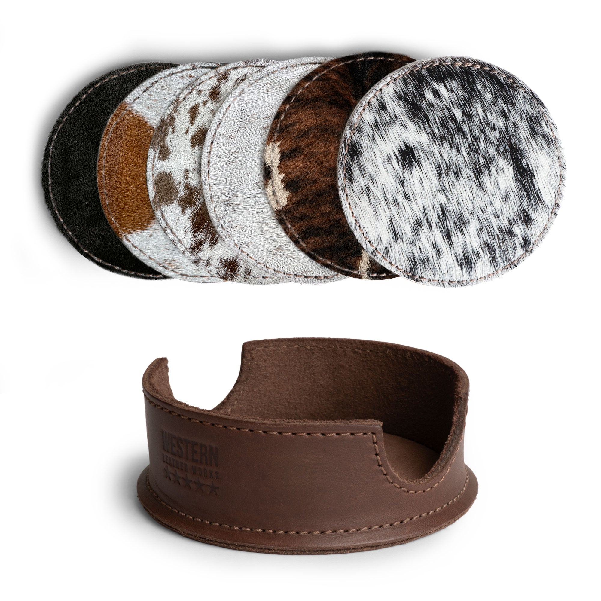 A selection of six unique hair-on-hide coasters from Western Leather Works, displayed alongside their storage holder, featured in the Set of 6 Circular Coasters for Drinks. These coasters provide excellent Glass & Cups Stain Protection made from Full Grain Leather through small batch production, emphasizing quality with hand cut and hand sewn details, fire branded for authenticity, handmade in La Antigua Guatemala & Oaxaca Mexico.