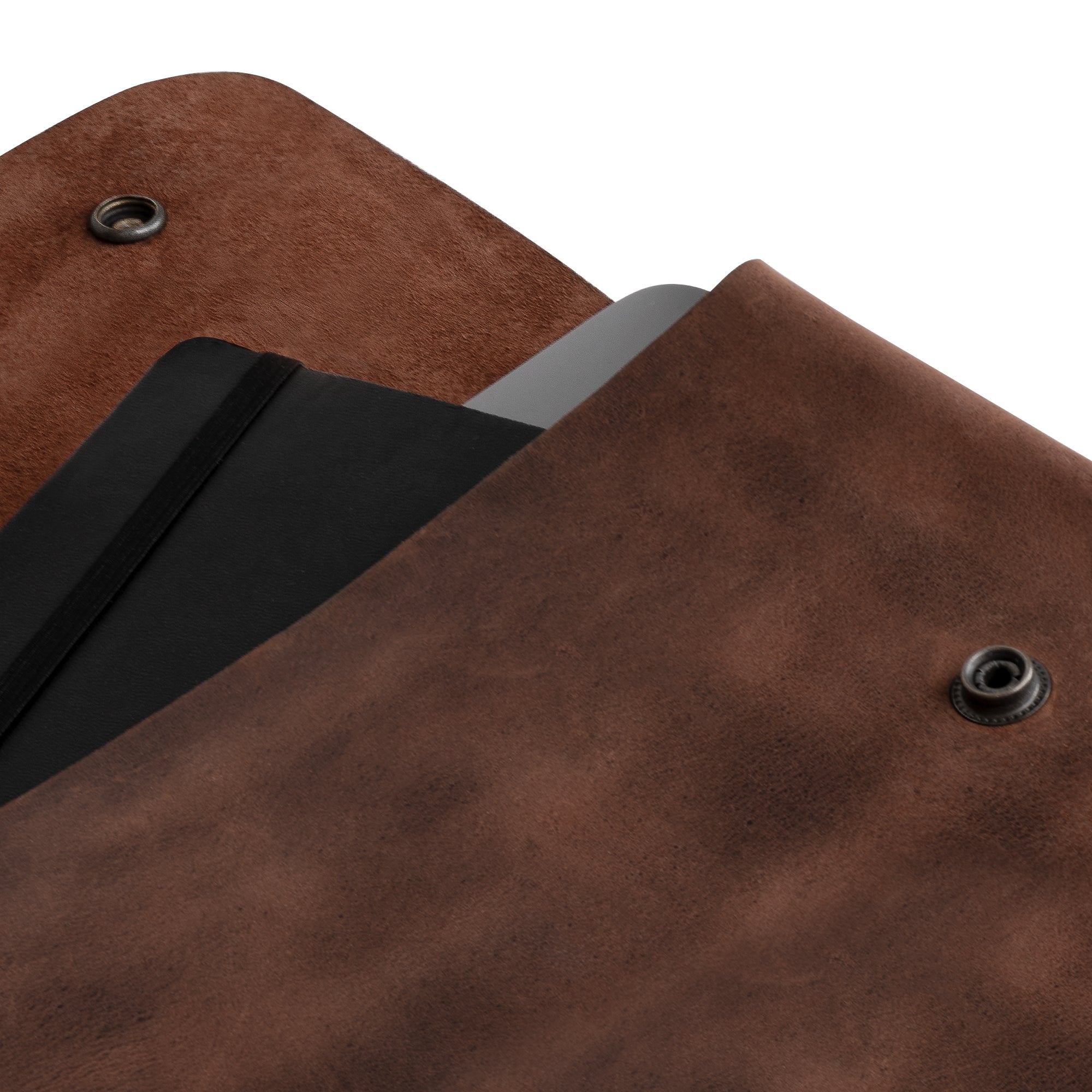 Close-up of the Leather Worx Folder Document Holder, highlighting its exquisite full grain leather texture. This vintage folder document holder is ideal for those needing a stylish document portfolio or binder strapless carry on bag, perfect for any office or work setup. Crafted in La Antigua Guatemala, it features hand sewn and hand cut craftsmanship, representing small batch production and artisan dedication.