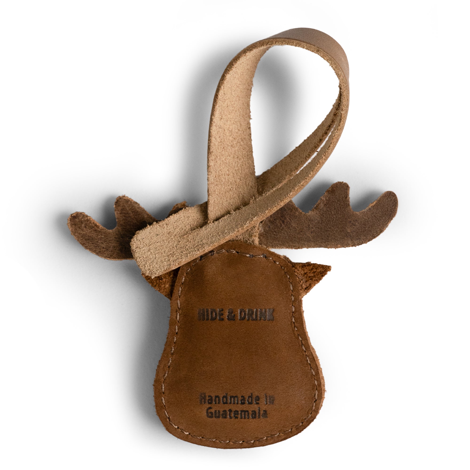 Hide & Drink Bag Charms displaying a beautifully designed dolphin, ideal charm for handbags. This purse charm for tote & backpacks made from premium full grain leather signifies StockyardX's commitment to small batch production. Each piece exemplifies hand cut, hand sewn artistry and fire branding, handmade in La Antigua Guatemala & Oaxaca Mexico.