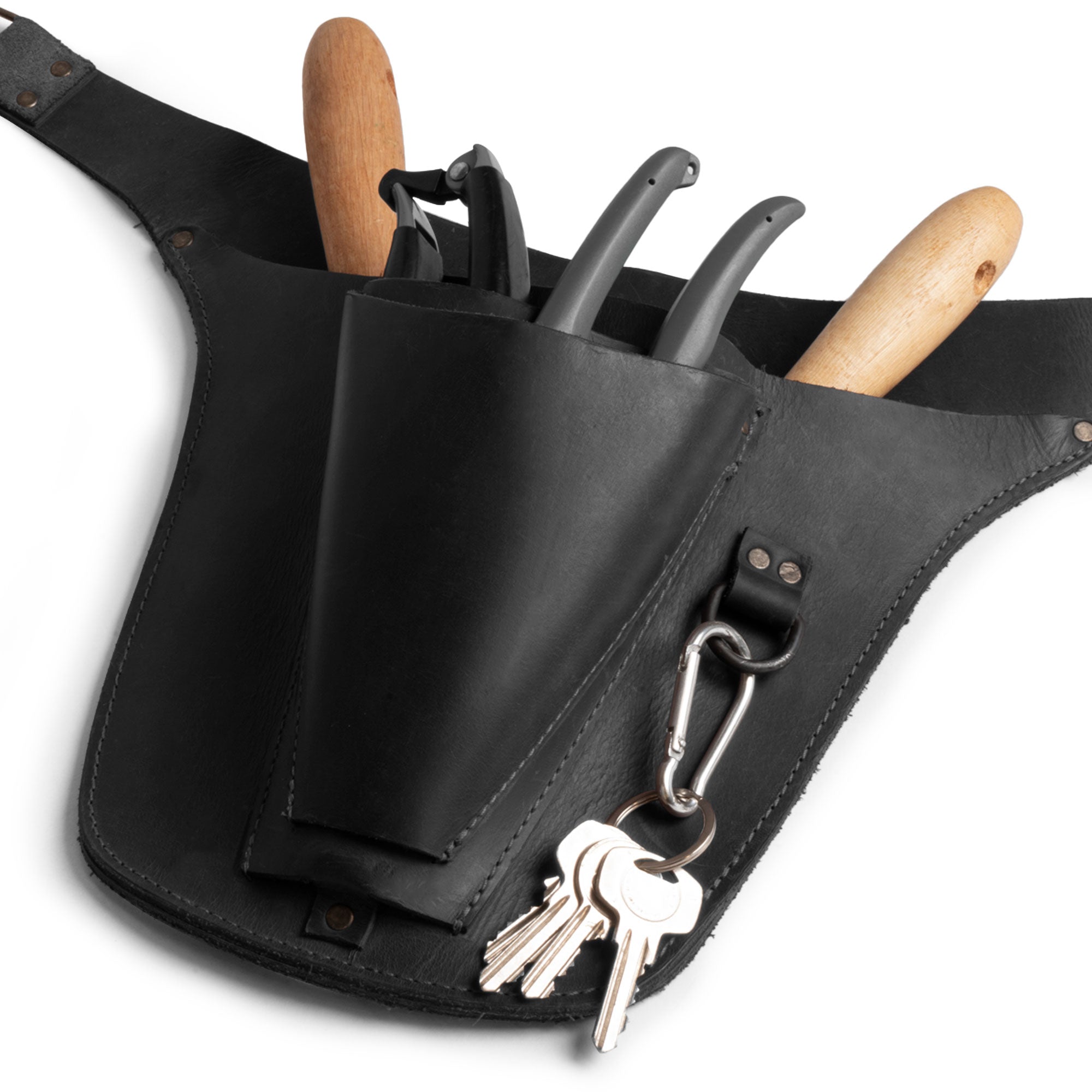 Close-up view of Hide & Drink's black Florist Tool Belt featuring robust storage options in Full Grain Leather. This Florist Tool Belt for Men & Women combines practicality and style, ideal for electricians and crafters. Handcrafted with care in La Antigua Guatemala & Oaxaca Mexico, highlighting small batch production.