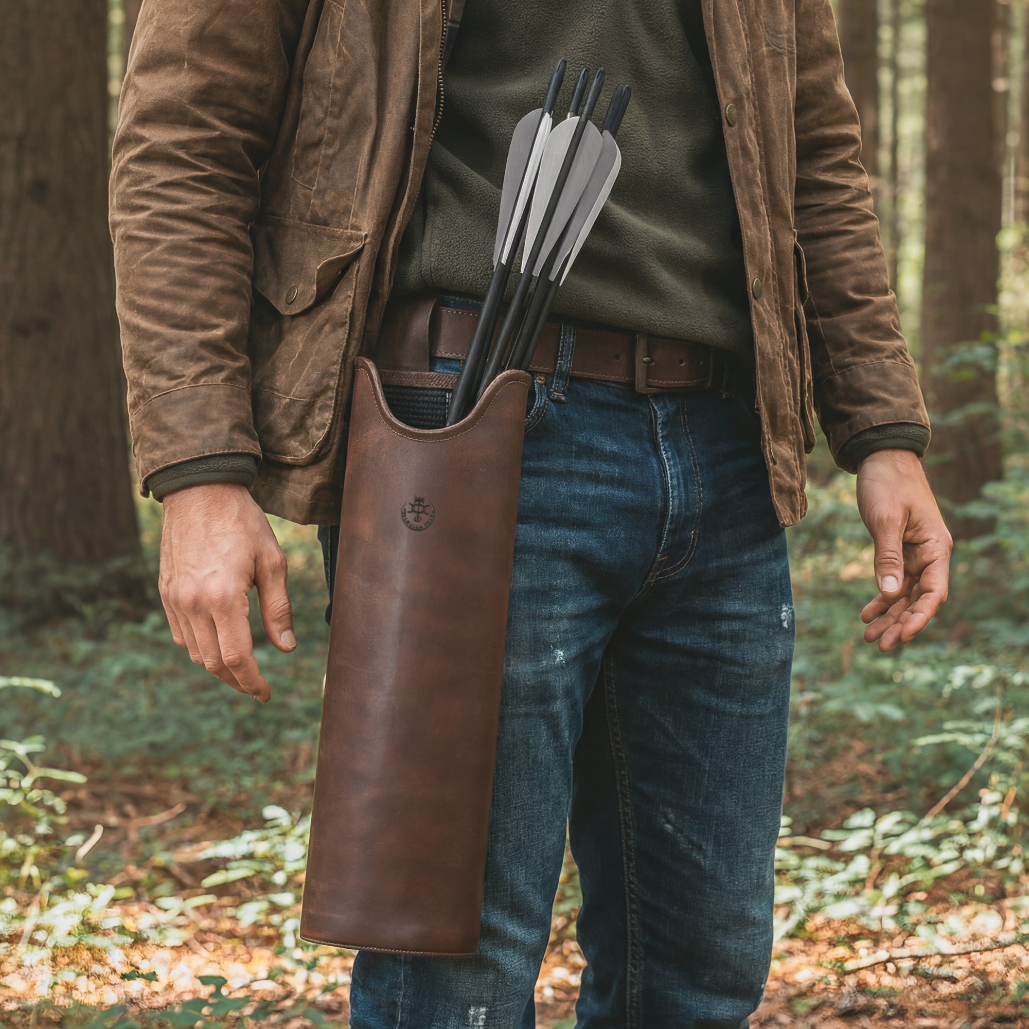The Orval, Bolts Hip Quiver in action, being worn by a man in an outdoor setting. This full grain leather crossbow quiver is designed as a waist cross bolt case and hip arrow holder, showcasing its versatility for archery and hunting. Handcrafted in La Antigua Guatemala, it combines function and style as a must-have accessory for archers.